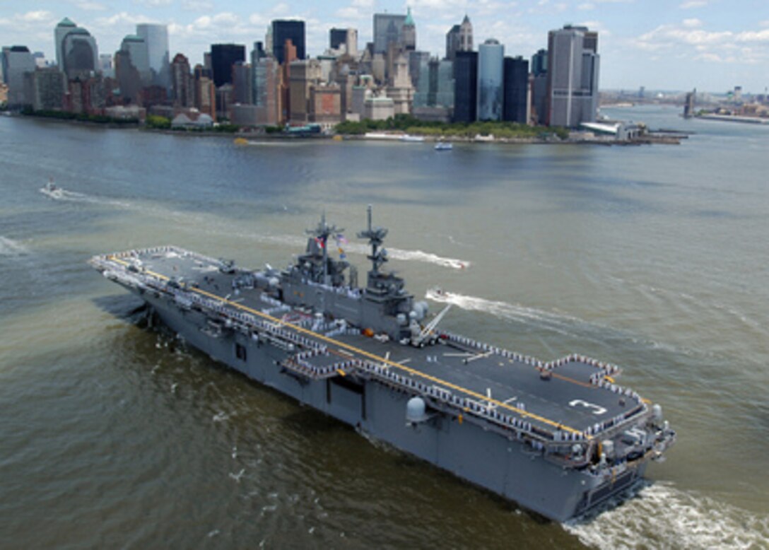 Sailors and Marines man the rails and spell out "I Love New York" on the flight deck of the amphibious assault ship USS Kearsarge (LHD 3) as the ship enters New York Harbor on May 24, 2006. The Kearsarge is in New York for the 19th annual Fleet Week New York 2006. 