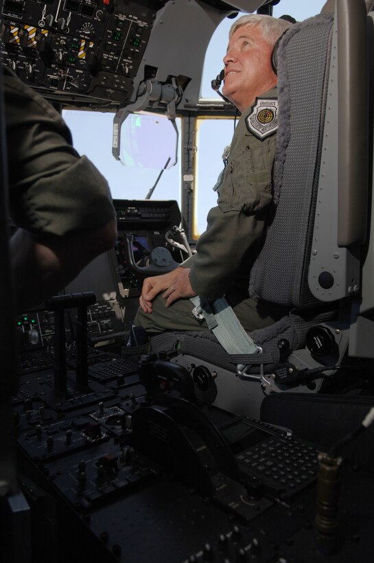 Maj. Gen. Allan R. Poulin, vice commander, Air Force Reserve Command, indicates a smooth ride and safe landing here May 26, when he delivered the latest addition to the 403rd Wing's fleet of C-130J-30 aircraft. A crew from the 403rd Wing accepted delivery of the new aircraft from Lockheed Martin, the manufacturer, in Marietta, Ga. earlier in the day. General Poulin, who spent much of his military career flying fighter aircraft, said he was impressed with the Herc. The 815th Airlift Squadron, the unit which employs the "stretched" transport, expects delivery of another aircraft before the end of the year. 