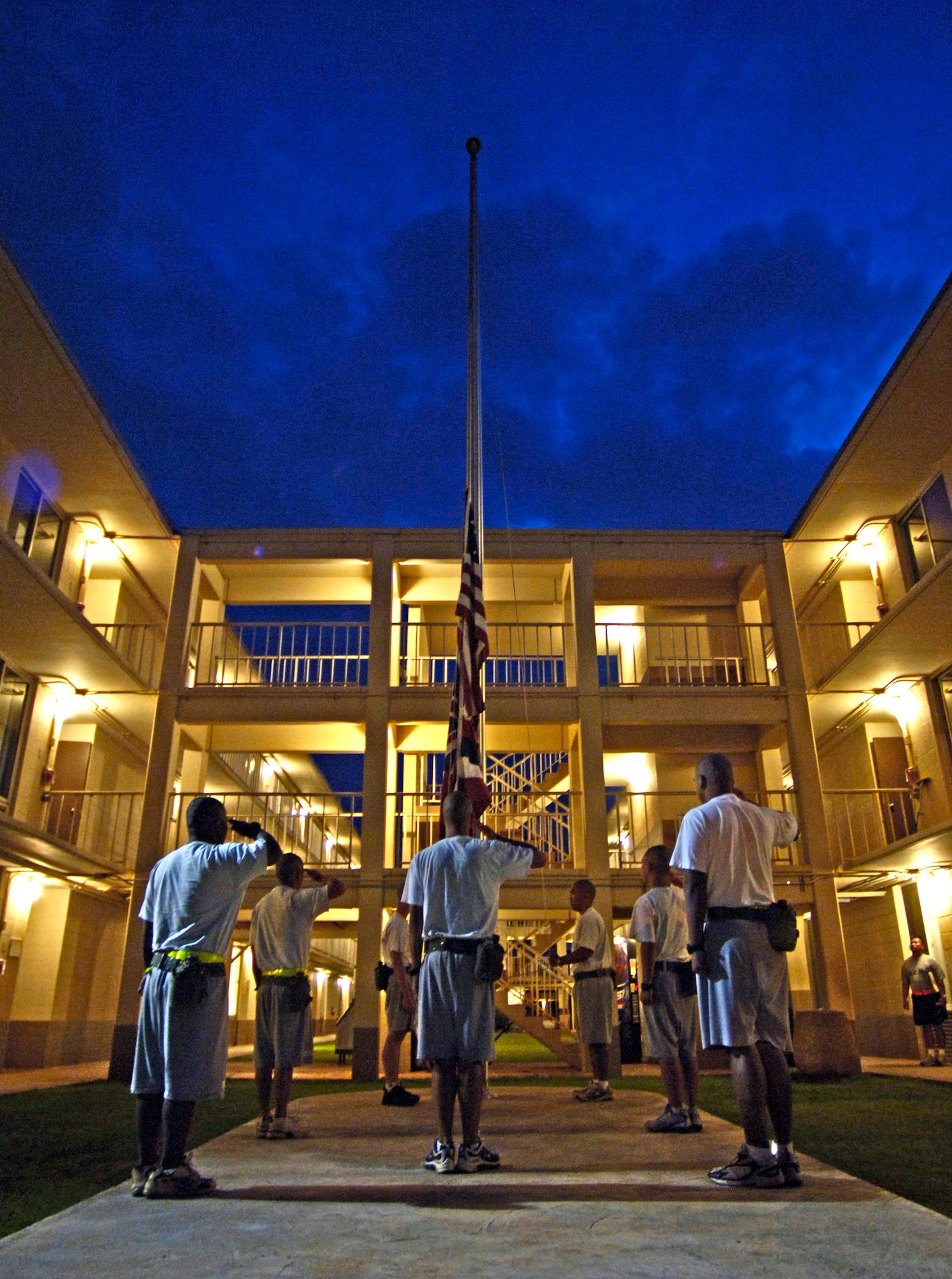 Cadets salute the flag at the Hawaii National Guard Youth Challenge Academy in Kapolei, Hawaii, on Thursday, May 18, 2006. The academy staff teach life skills to non-traditional students so they can be successful in the community and earn a high school diploma.  (U.S. Air Force photo/Tech. Sgt. Shane A. Cuomo)