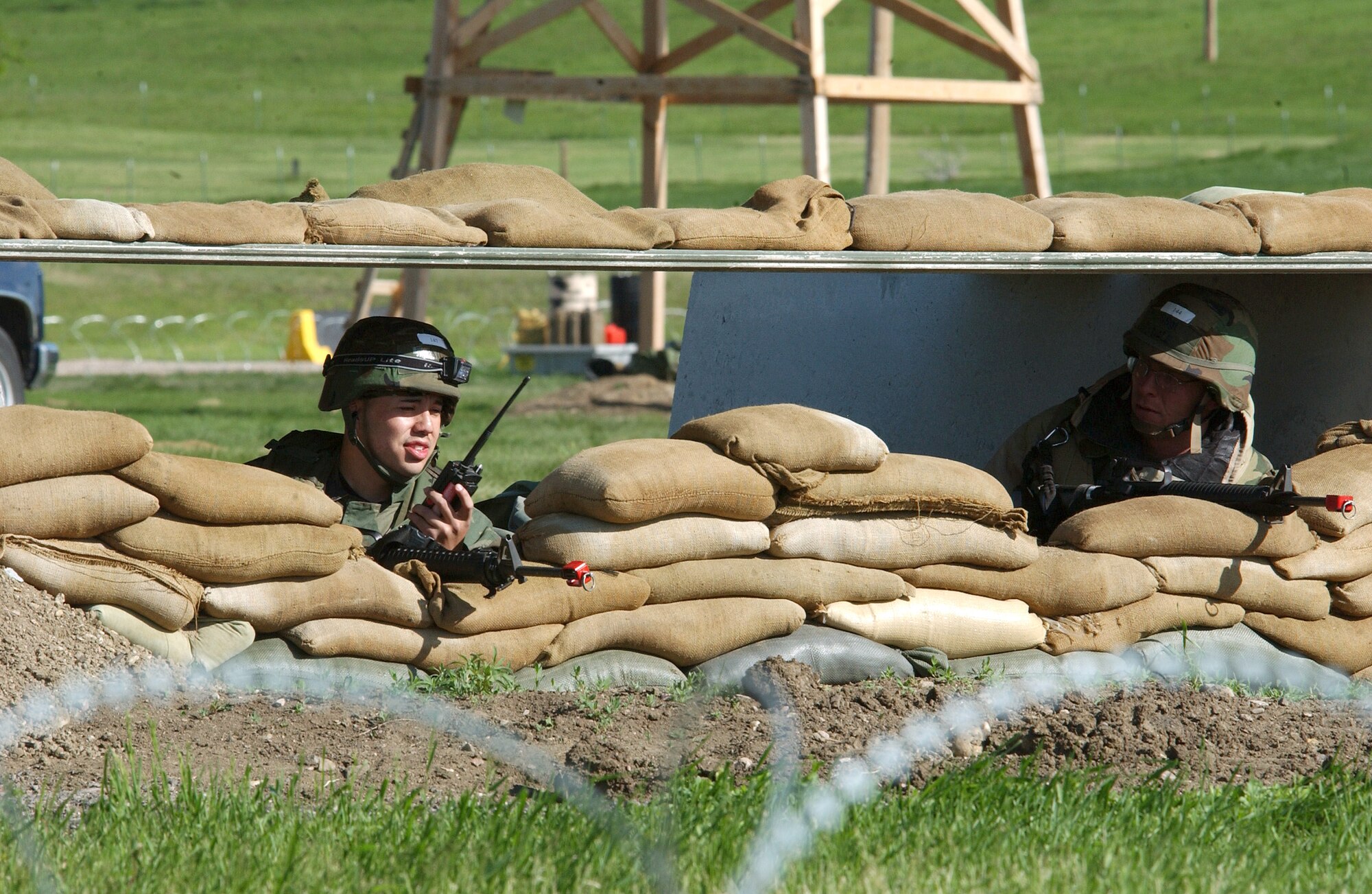 Airmen from the 28th Bomb Wing take cover in a bunker during a simulated ground attack, part of an operational readiness exercise at Ellsworth Air Force Base, S.D., on Wednesday, May 24, 2006. (U.S. Air Force photo/Airman Anthony Sanchelli)