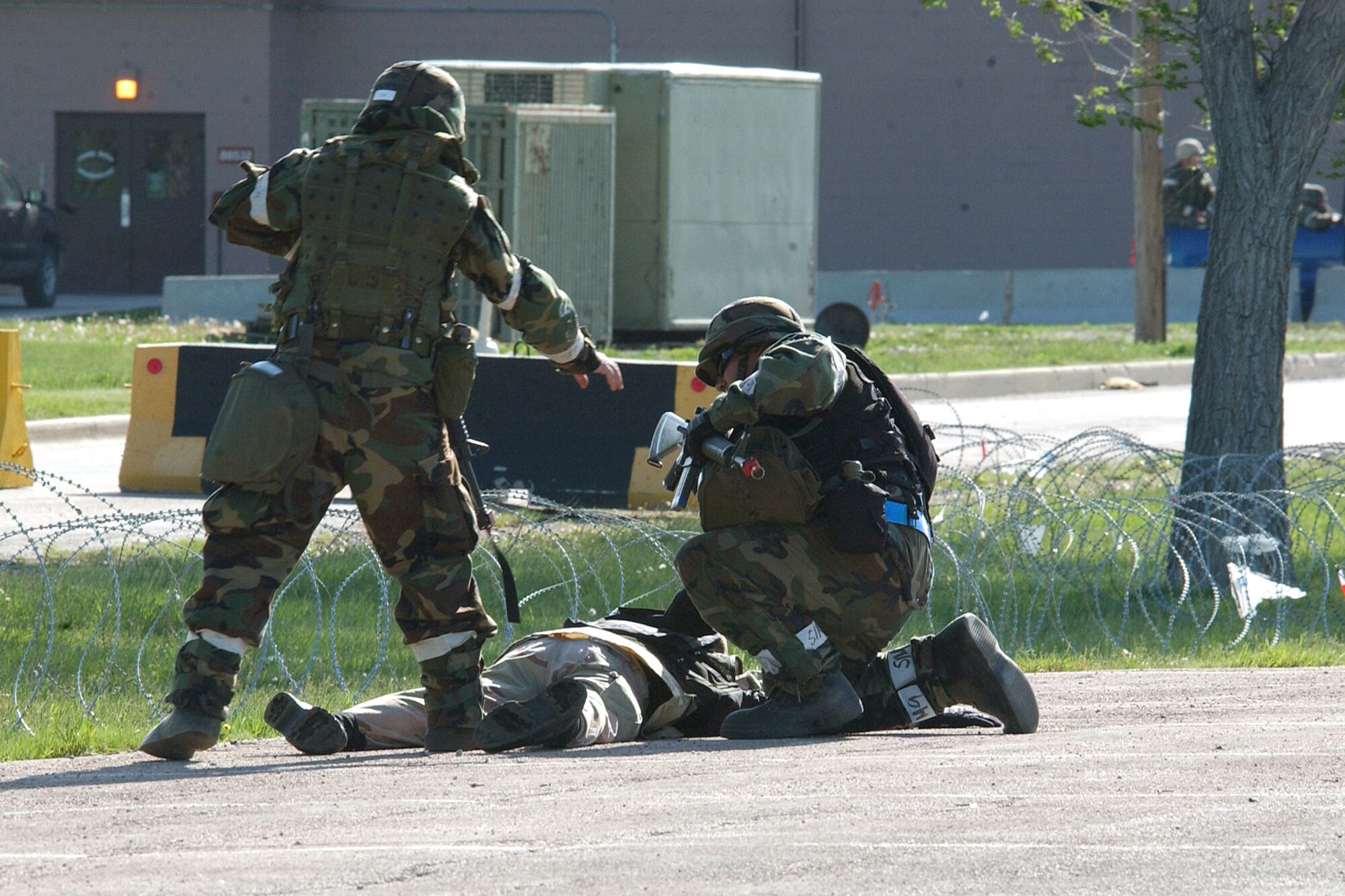 Airmen from the 28th Bomb Wing simulate apprehension of an armed terrorist during an operational readiness exercise at Ellsworth Air Force Base, S.D., on Wednesday, May 24, 2006. (U.S. Air Force photo/Airman Anthony Sanchelli)
