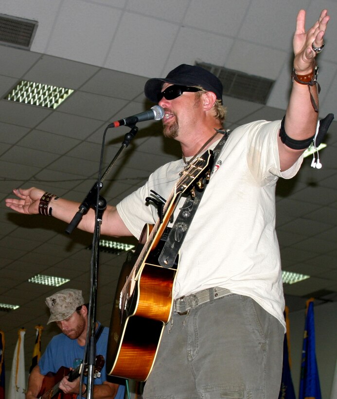 CAMP FALLUJAH, Iraq -- Country music sensation Toby Keith performed for servicemember here Memorial Day May 29. The show was a part of the USO's five-day Toby Keith Tour of Iraq.Keith performed the acoustic show for more than 4,000 servicemembers.
