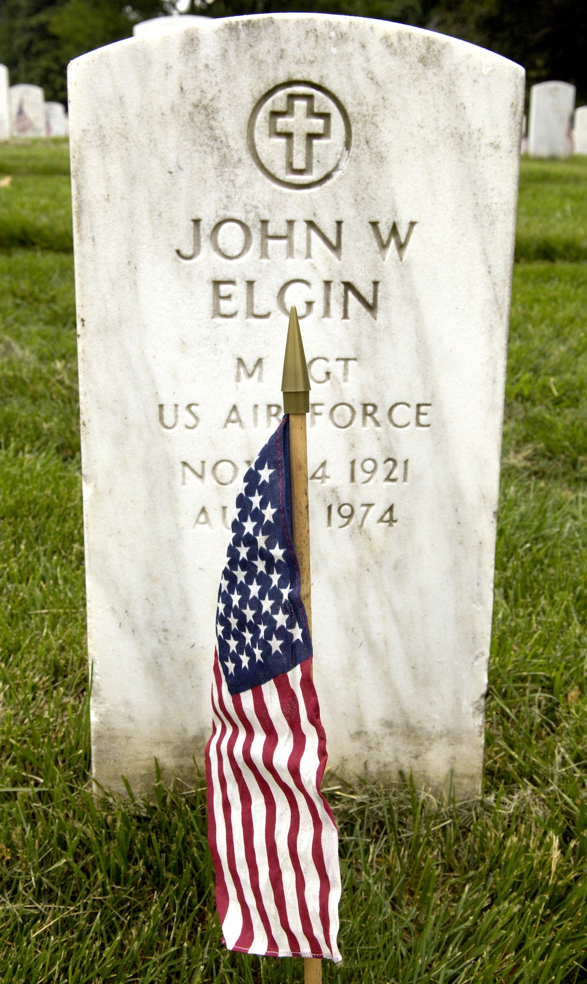 Soldiers, Sailors, Airmen and Marines from across the Washington D.C. area joined forces to place more than 227,000 flags at the front of headstones at Arlington National Cemetery on Thursday, May 25, 2006. The flags will remain at the headstones through Memorial Day. (U.S. Air Force photo/Master Sgt. Jim Varhegyi)