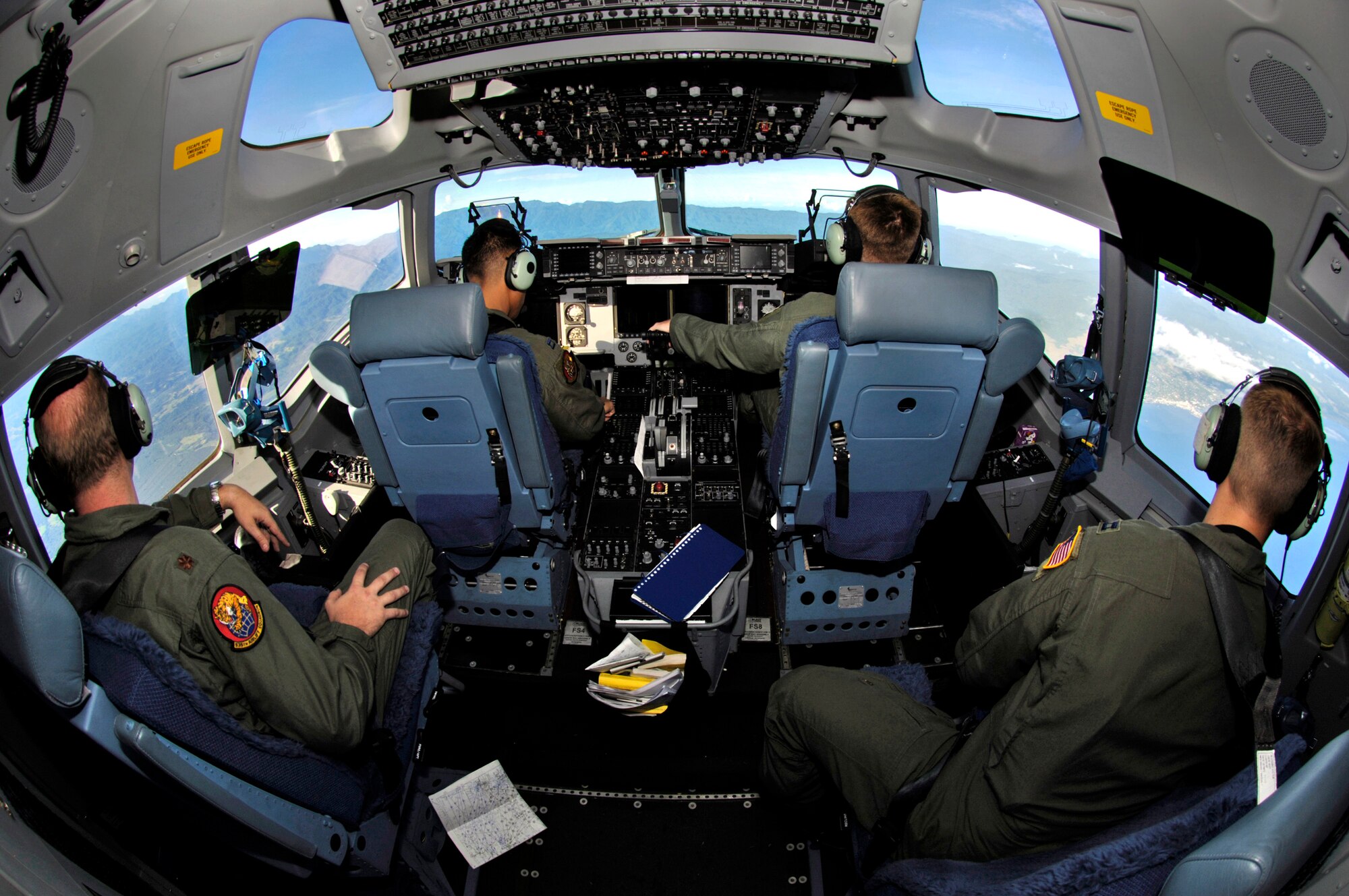 C-17 Globemaster III crew members view Guadalcanal during take-off from Honiara International Airport, Solomon Islands, on Sunday, May 28, 2006. Two C-17 Globemaster IIIs and their crews are helping the Australian Defense Force reposition its forces from the Solomon Islands back to Australia to better support peace operations in East Timor. (U.S. Air Force photo/Tech. Sgt. Shane A. Cuomo) 

