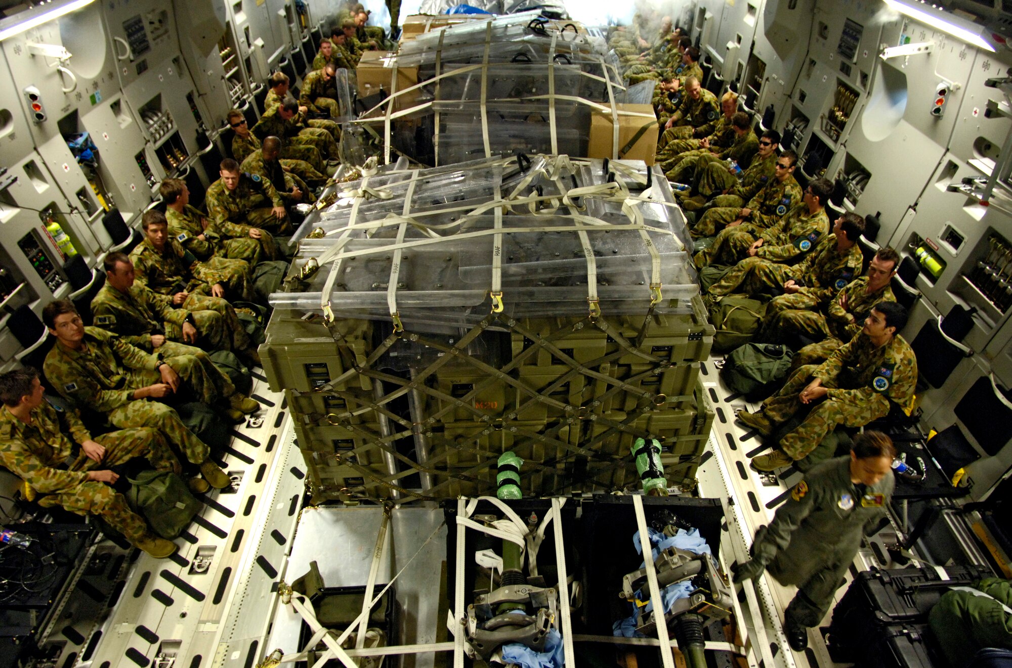 Members of the Australian Defense Force and their equipment are loaded onto a C-17 Globemaster III at Honiara International Airport, Solomon Islands, on Sunday, May 28, 2006.  Two C-17 Globemaster IIIs and their crews are helping the Australian Defense Force reposition its forces from the Solomon Islands back to Australia to better support peace operations in East Timor. (U.S. Air Force photo/Tech. Sgt. Shane A. Cuomo)