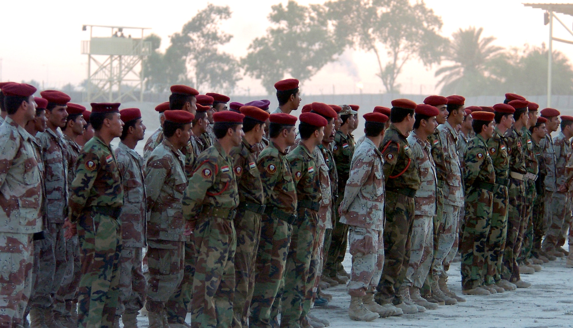 Soldiers of the 1st Iraqi Army Division/Iraqi Intervention Forces on Ar Rasheed Base, Iraq, line up on Thursday, May 25, 2006. The 250 soldiers, who provide defense for the compound, are trained and advised by five security forces Airmen and their Army commander who live and work on the base. (U.S. Air Force photo/Senior Airman Brian Ferguson)
