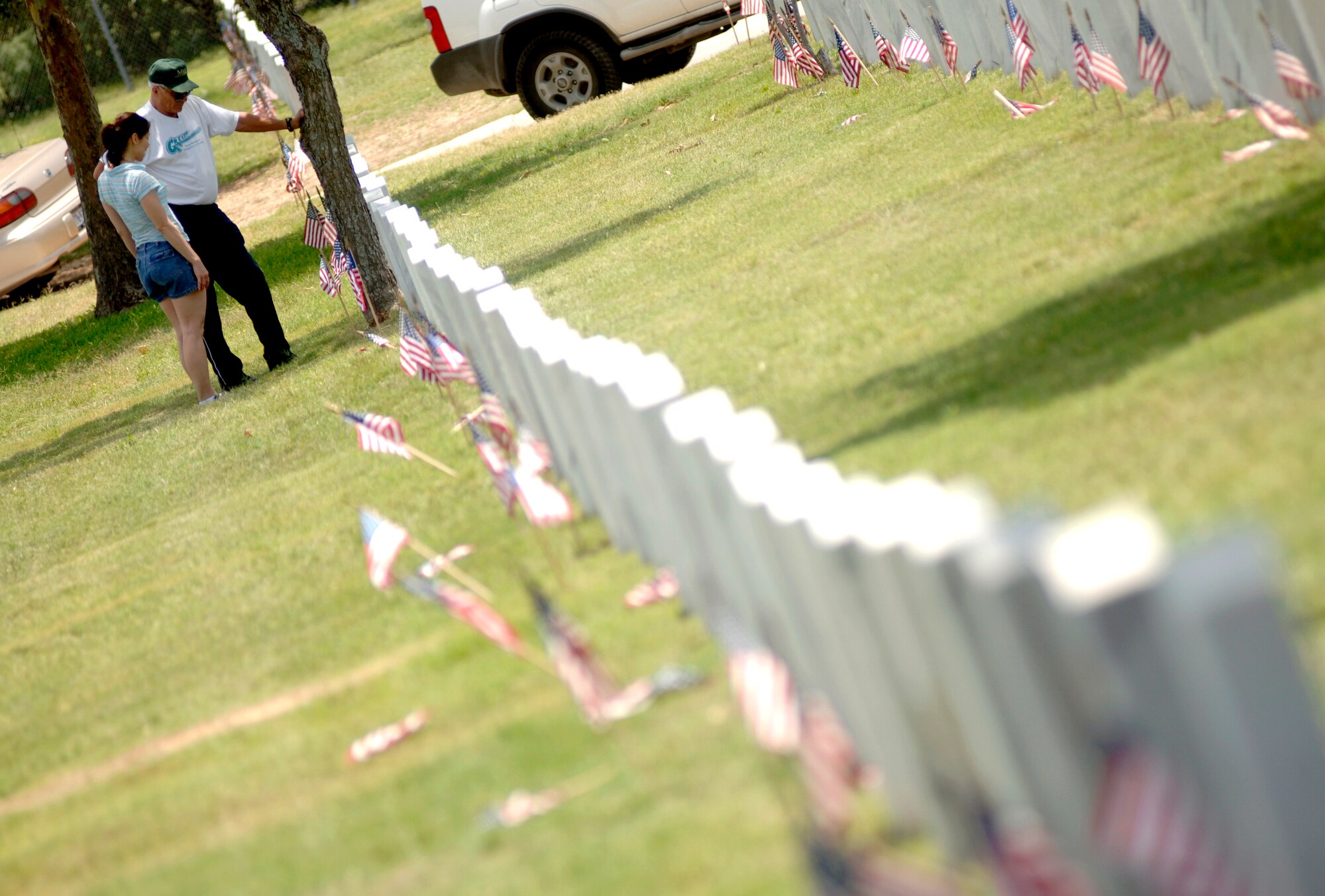 Lorenzo Sanchez and his daughter, Veronica, visit the grave site of his father, Ignacio Sanchez, at Fort Sam Houston National Cemetery in San Antonio on Sunday, May 28, 2006. Ignacio Sanchez immigrated from Mexico in 1914 and served in the U.S. Army during World War II. (U.S. Air Force photo/Tech. Sgt. Cecilio Ricardo) 
