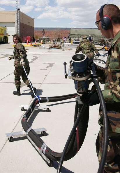 Members of the 302nd Airlift Wing test the Modular Airborne Fire Fighting System at Peterson Air Force Base, Colo., in preparation for the 2006 wild fire season. (U.S. Air Force photo/Tech Sgt. Timothy Taylor)