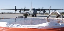 Members of the 302nd Airlift Wing test the Modular Airborne Fire Fighting System at Peterson Air Force Base, Colo., in preparation for the 2006 wild fire season. (U.S. Air Force photo/Tech Sgt. Timothy Taylor)