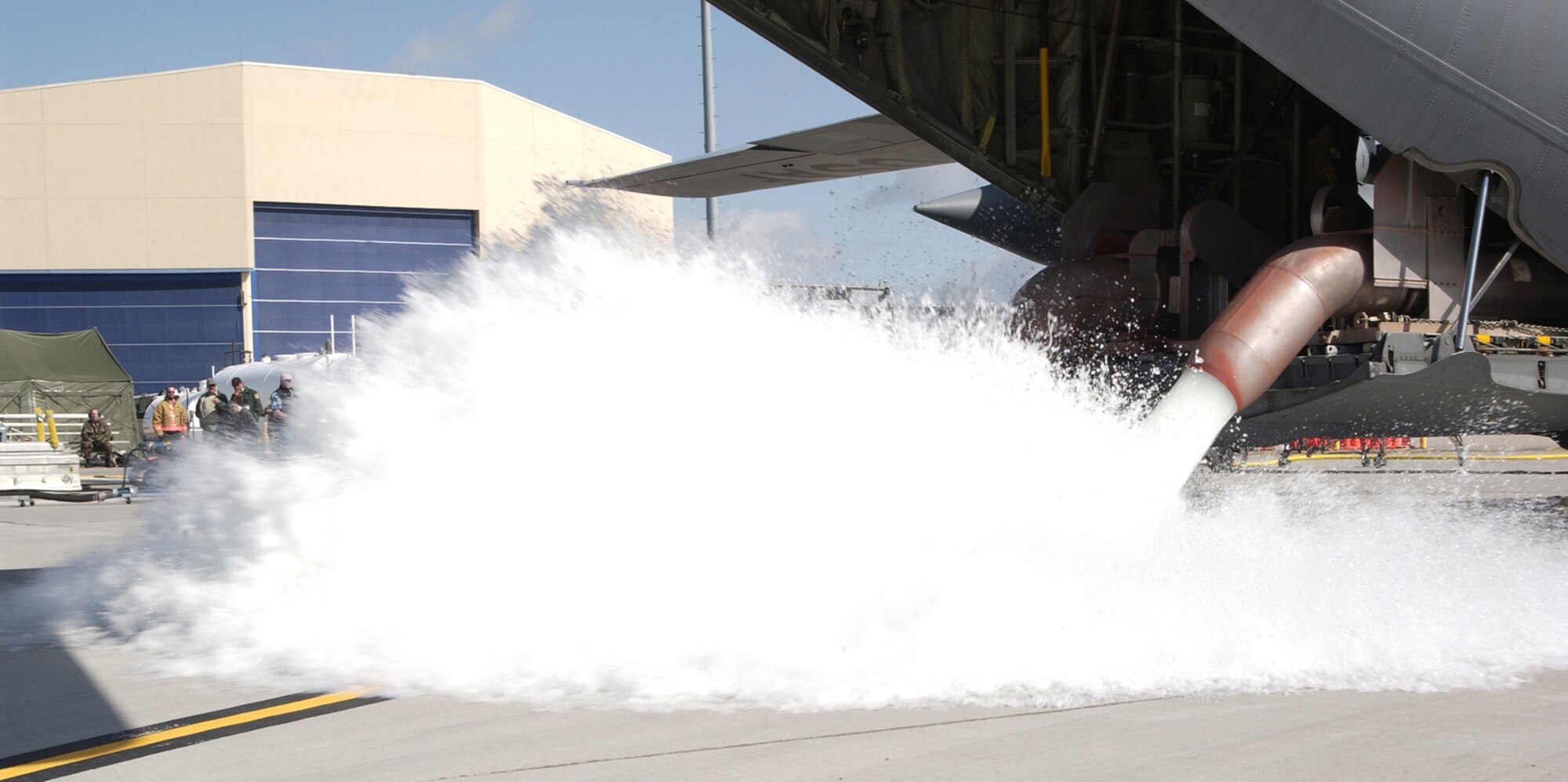 Members of the 302nd Airlift Wing test the Modular Airborne Fire Fighting System at Peterson Air Force Base, Colo., in preparation for the 2006 wild fire season. (U.S. Air Force photo/Tech Sgt. Timothy Taylor)