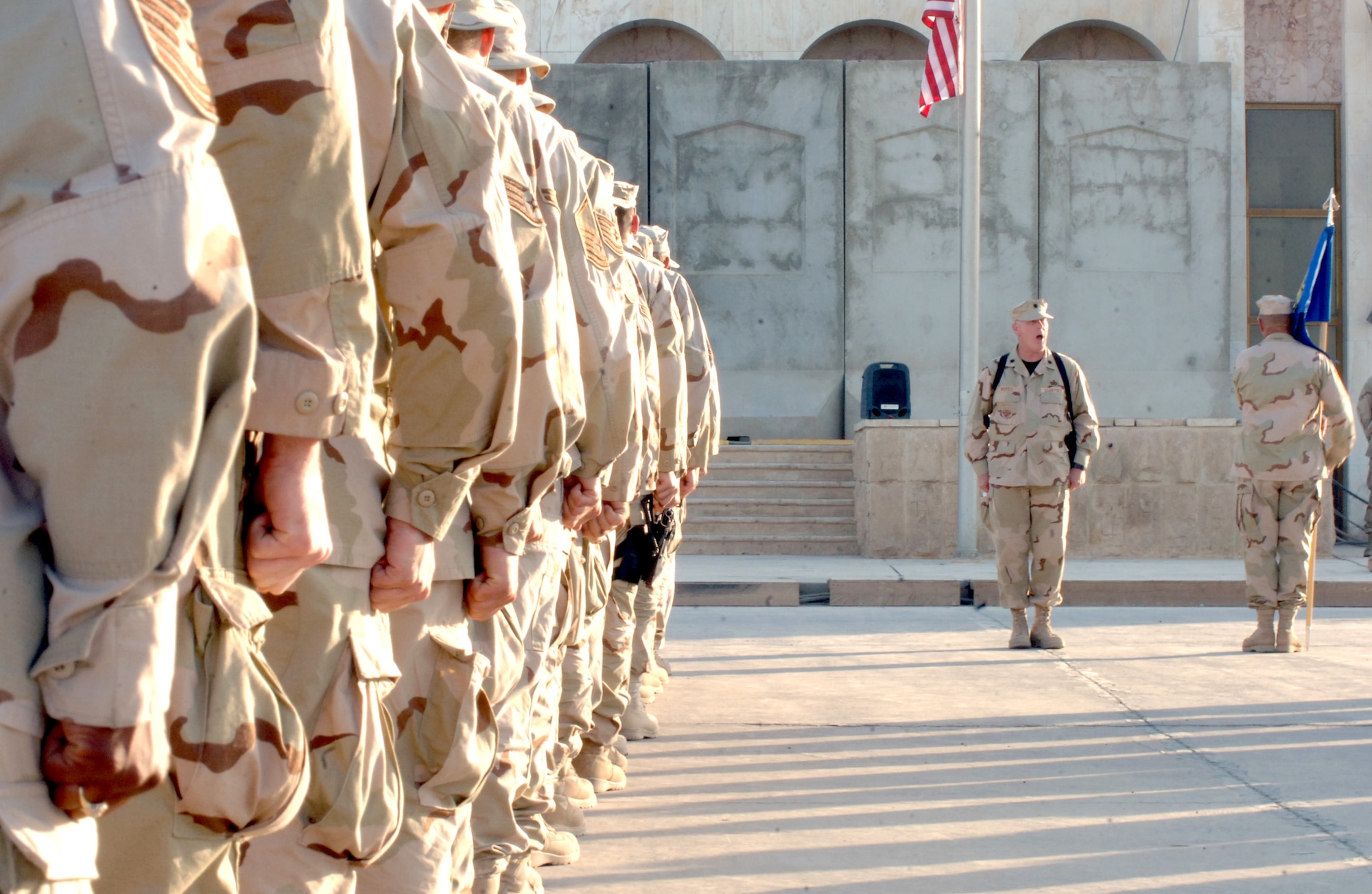 Lt. Col. John Morris calls his formation to parade rest at a Memorial Day retreat ceremony at Sather Air Base, Iraq, on Monday, May 29, 2006. Colonel Morris, deployed from March Air Reserve Base, Calif., is the 447th Air Expeditionary Group deputy commander. The 447th AEG operates the primary aerial port for transient military aircraft entering and exiting Iraq. The base is named in honor of Staff Sgt. Scott Sather, a Clio, Mich., native who was killed in combat in Iraq on April 8, 2003. (U.S. Air Force photo/Staff Sgt. Bryan Bouchard)