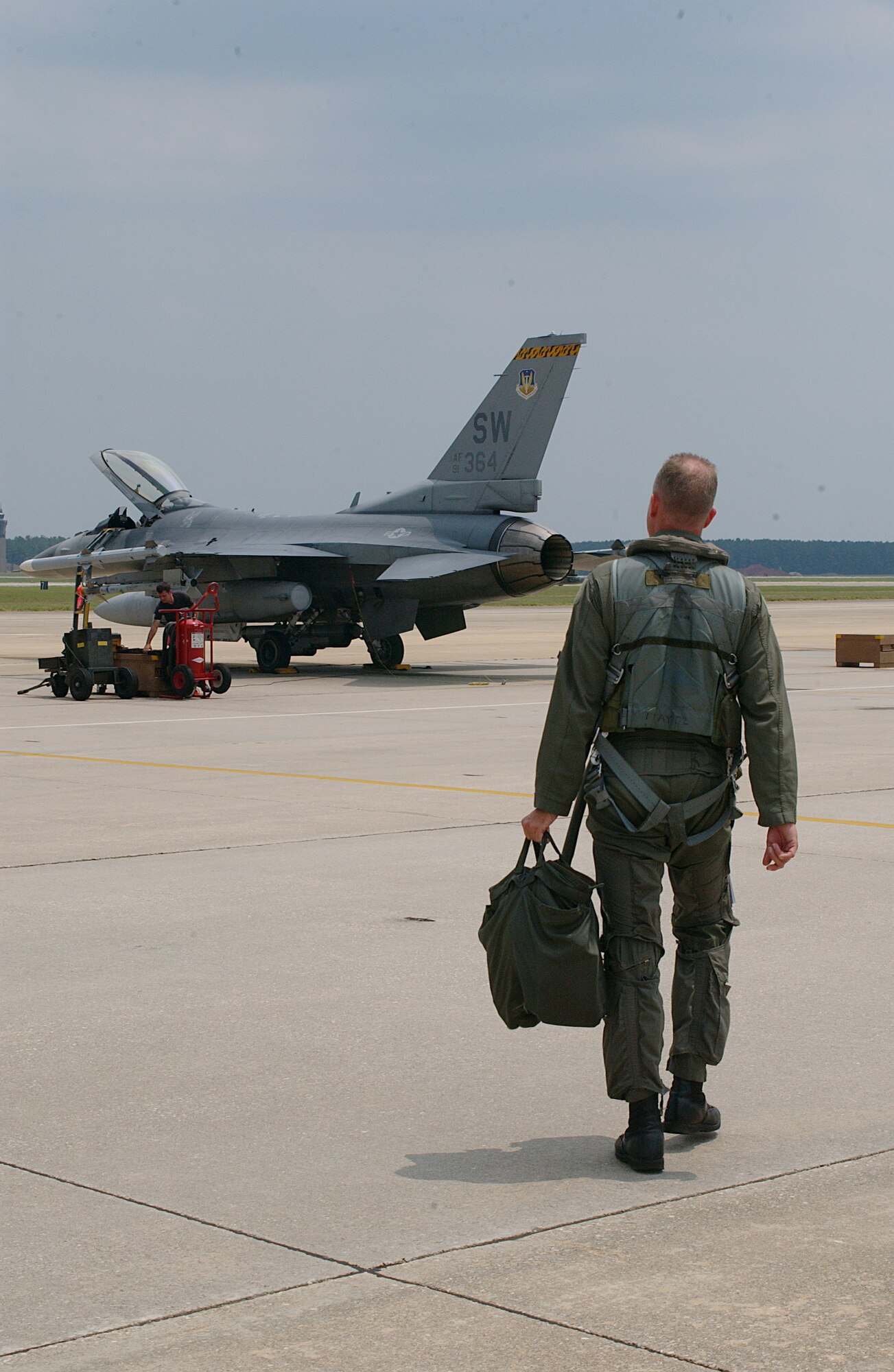 Col. Michael Beale steps to a jet Wednesday for his last flight as 20th Fighter Wing vice commander.  (U.S. Air Force Photo/Staff Sgt. Nathan Brevier)