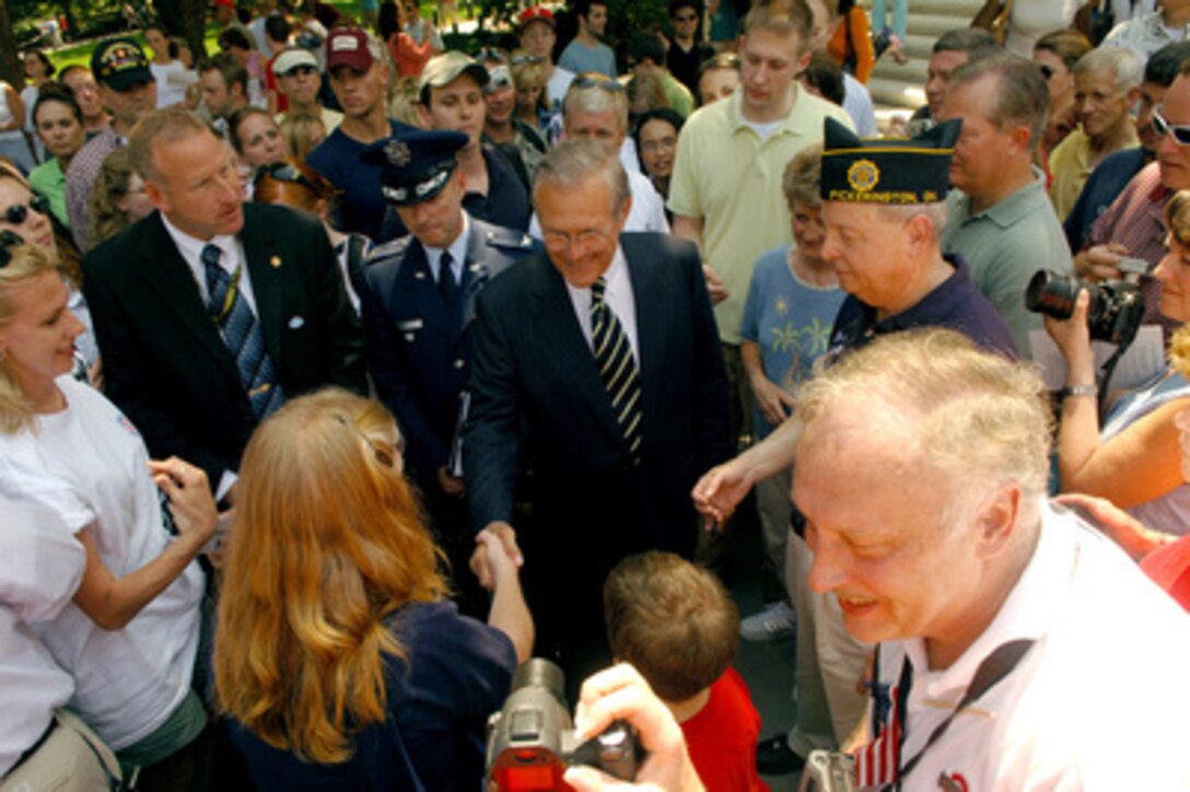 Secretary of Defense Donald H. Rumsfeld greets veterans and well-wishers after Memorial Day ceremonies at Arlington National Cemetery on May 29, 2006. Rumsfeld earlier joined President George W. Bush and Chairman of the Joint Chiefs of Staff Gen. Peter Pace, U.S. Marine Corps, in paying tribute to generations of Americans who have died while serving their country. 