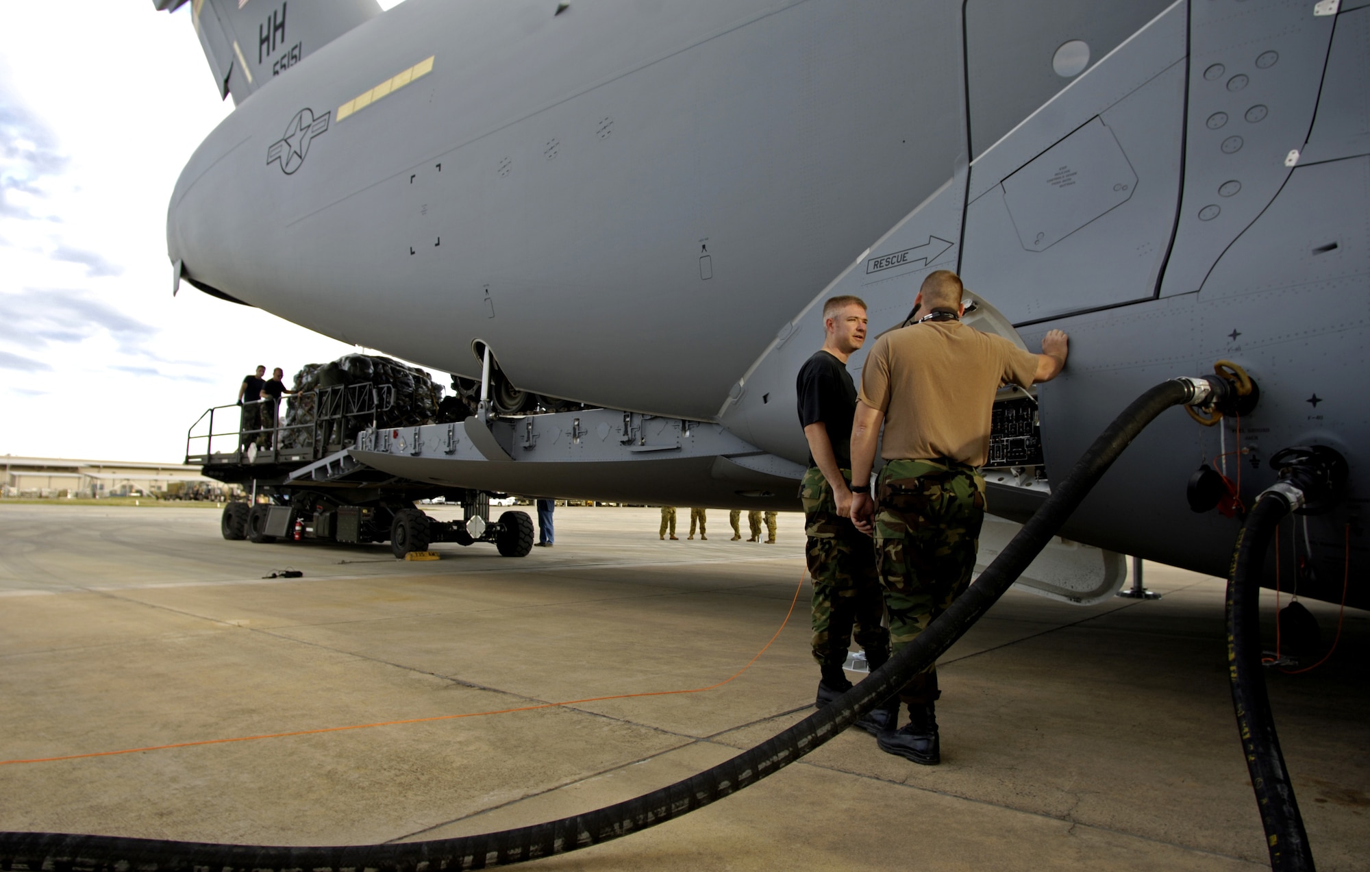 060530-F-2034C-021
Staff Sgt. Marcus Sorrells and Tech. Sgt. Jeremy Barber refuel a C-17 Globemaster III May 30, 2006 at Royal Australian Air Force Base Townsville, Australia. Sgt.?s Sorrells and Barber are from the 15th Maintenance Squadron Hickam Air Force Base, Hawaii. Two C-17?s from the 15th Airlift Wing and 154th Wing Hawaii Air National Guars, Hickam are helping the Australian Defense Force reposition its forces in Australian to better support the peace operations in East Timor. (U.S. Air Force photo by Tech. Sgt. Shane A. Cuomo)
