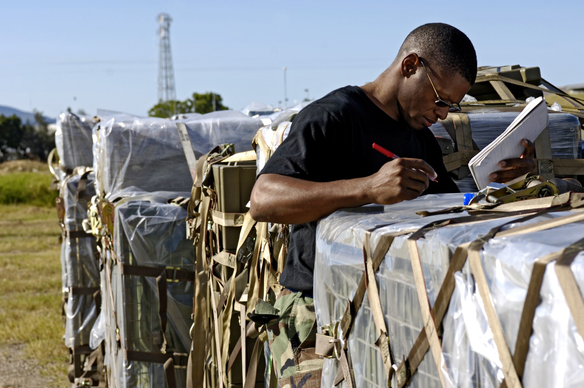 060530-F-2034C-001
Staff Sgt. Oscar Merritt writes down weights and measurements of Australian equipment pallets May 30, 2006 at Royal Australian Air Force Base Townsville, Australia. SSgt Merritt is from the 15th Logistical Readiness Squadron, Combat Mobility Element. The CME is in Townsville to help prepare and load equipment on C-17 Globemaster III from Hickam Air Force Base, Hawaii that are repositioning Australian Defense Forces inside Australia to better support peace operations in East Timor. (U.S. Air Force photo by Tech. Sgt. Shane A. Cuomo) 
