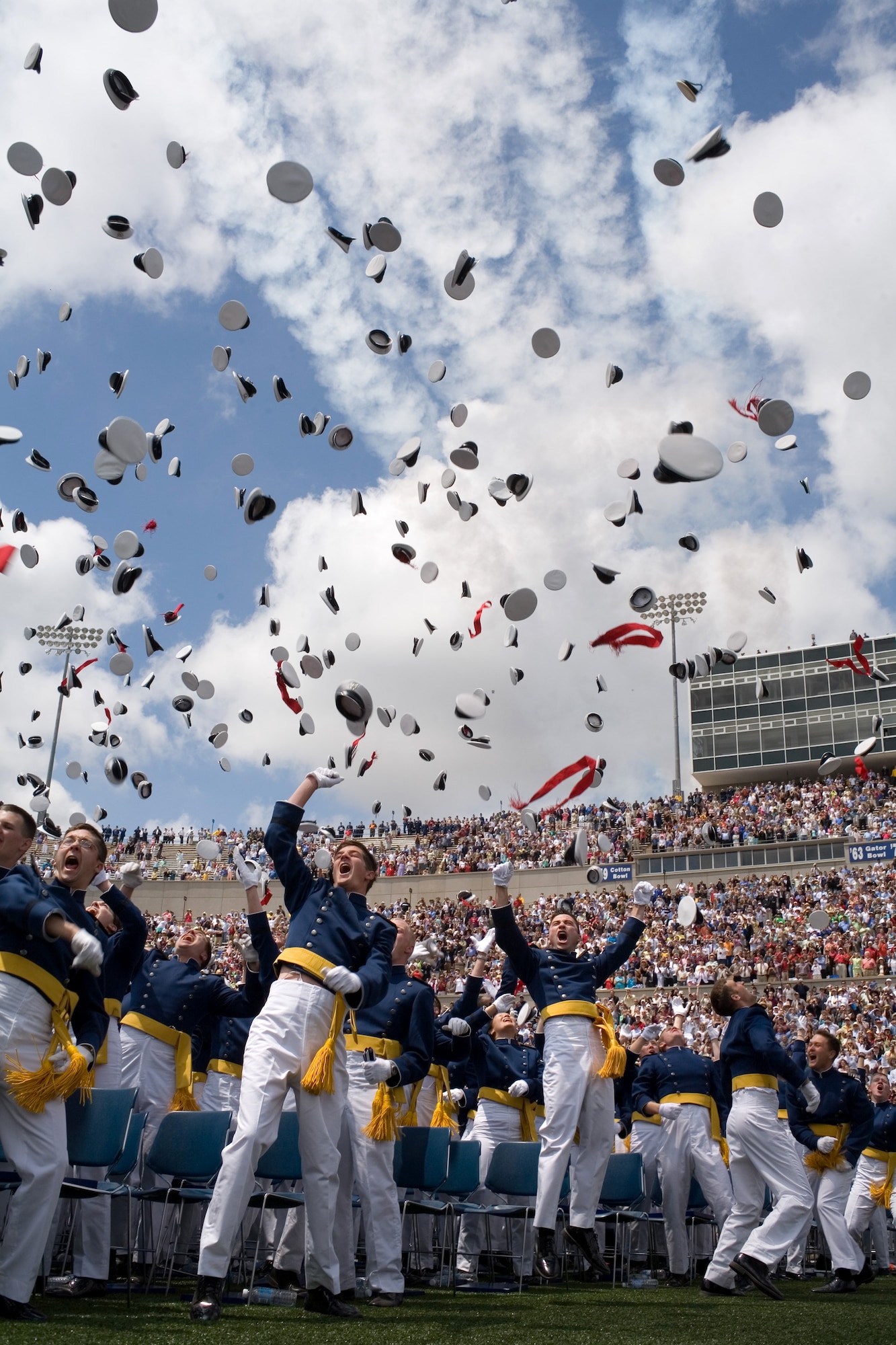 Newly commissioned second lieutenants toss their hats skyward at the conclusion of the U.S. Air Force Academy's 2006 graduation ceremony in Colorado Springs, Colo., on Wednesday, May 31, 2006. The Class of 2006 totaled 879 graduates, with 491 of them slated for undergraduate pilot training. Secretary of Defense Donald H. Rumsfeld was the guest speaker at the commencement. (U.S. Air Force photo/Ken Wright)