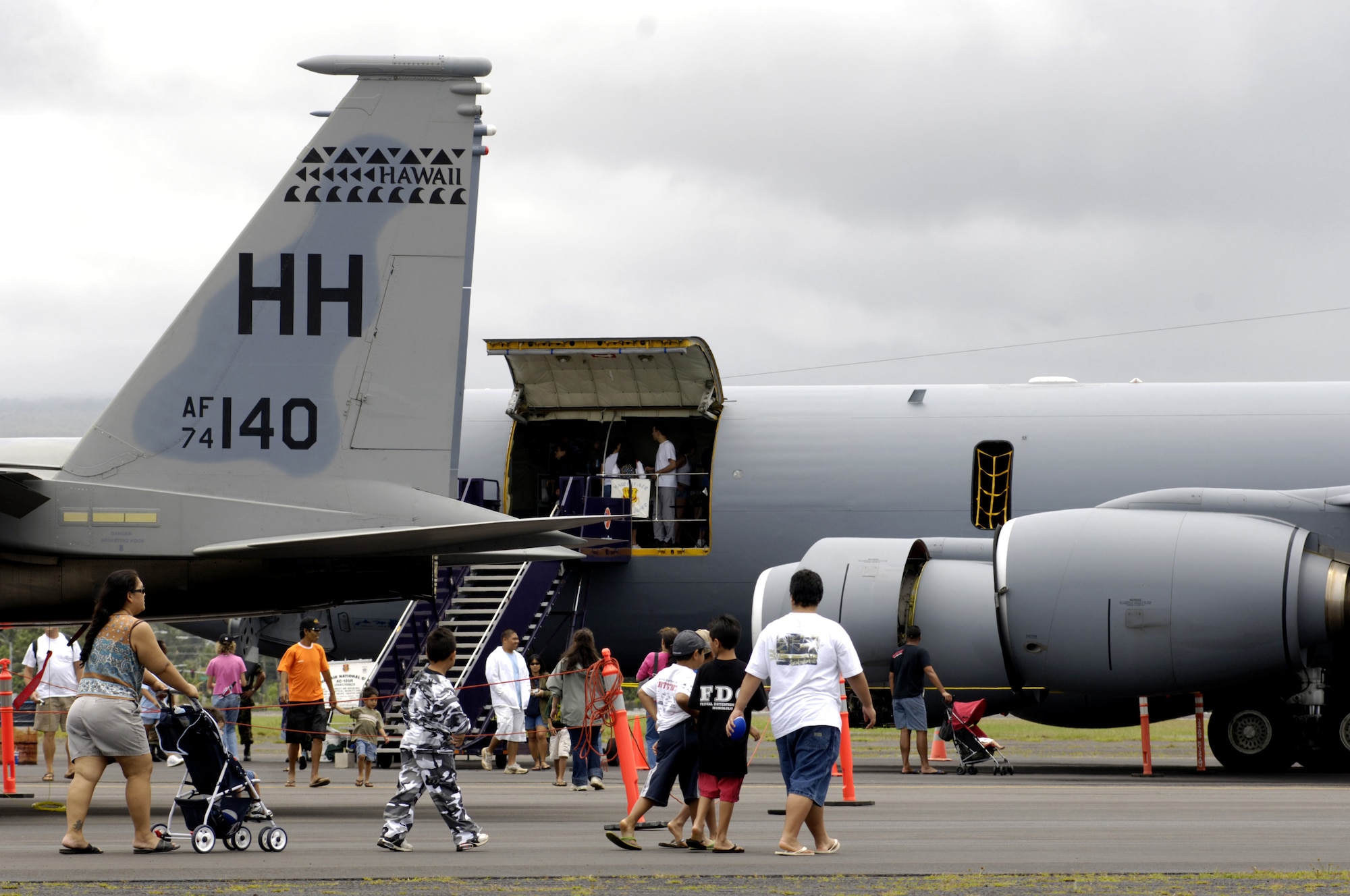 060520-F-2034C-026
Visitors walks past an F-15 Eagle and a KC-135 Extender on static display May 20, 2006 during the Hilo Air Show at Hilo International Airport, Hawaii. The Hawaii Air National Guard hosted the Armed Force Day air show to give the public a chance to view various aircraft stationed in Hawaii and to generate public interest in the military. (U.S. Air Force photo by Tech. Sgt. Shane A. Cuomo)
