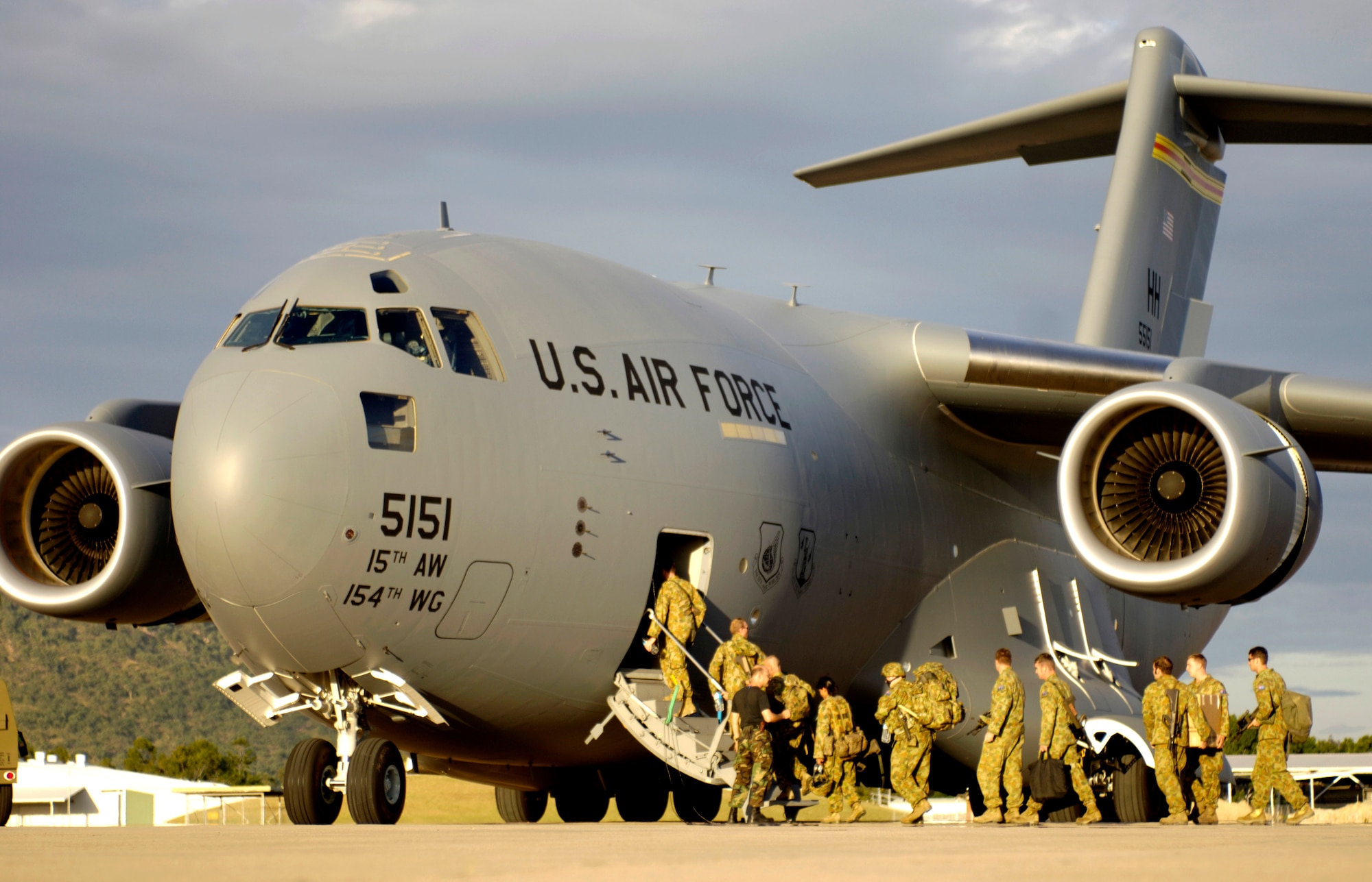 Australian Defense Forces board a C-17 Globemaster III at Royal Australian Air Force Base Townsville, Australia, on Tuesday, May 30, 2006. Two C-17s from the 15th Airlift Wing and the Hawaii Air National Guard's 154th Wing at Hickam Air Force Base, Hawaii, are helping the Australian Defense Force reposition its forces in Australia to better support peace operations in East Timor. (U.S. Air Force photo by Tech. Sgt. Shane A. Cuomo) 