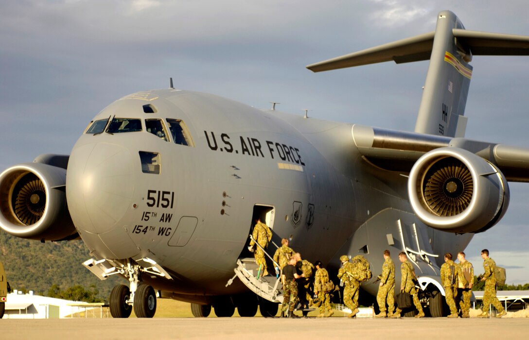 Australian Defense Forces board a C-17 Globemaster III at Royal Australian Air Force Base Townsville, Australia, on Tuesday, May 30, 2006. Two C-17s from the 15th Airlift Wing and the Hawaii Air National Guard's 154th Wing at Hickam Air Force Base, Hawaii, are helping the Australian Defense Force reposition its forces in Australia to better support peace operations in East Timor. (U.S. Air Force photo by Tech. Sgt. Shane A. Cuomo) 
