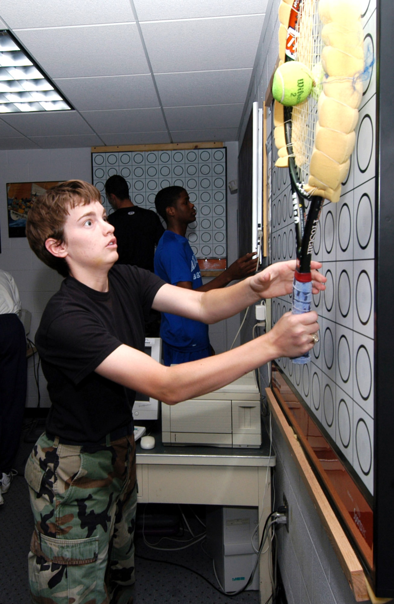 Cadet 1st Class Kat Bushey tests her hand-eye coordination at the Air Force Academy Human Performance Lab on Tuesday, May 23, 2006.  The lab is refining techniques to help today's warfighter adapt to high-altitude locations like those found in Afghanistan.  One of the lab's major areas of focus is on visual performance improvement.  (U.S. Air Force photo/Jamie Romero)

 

