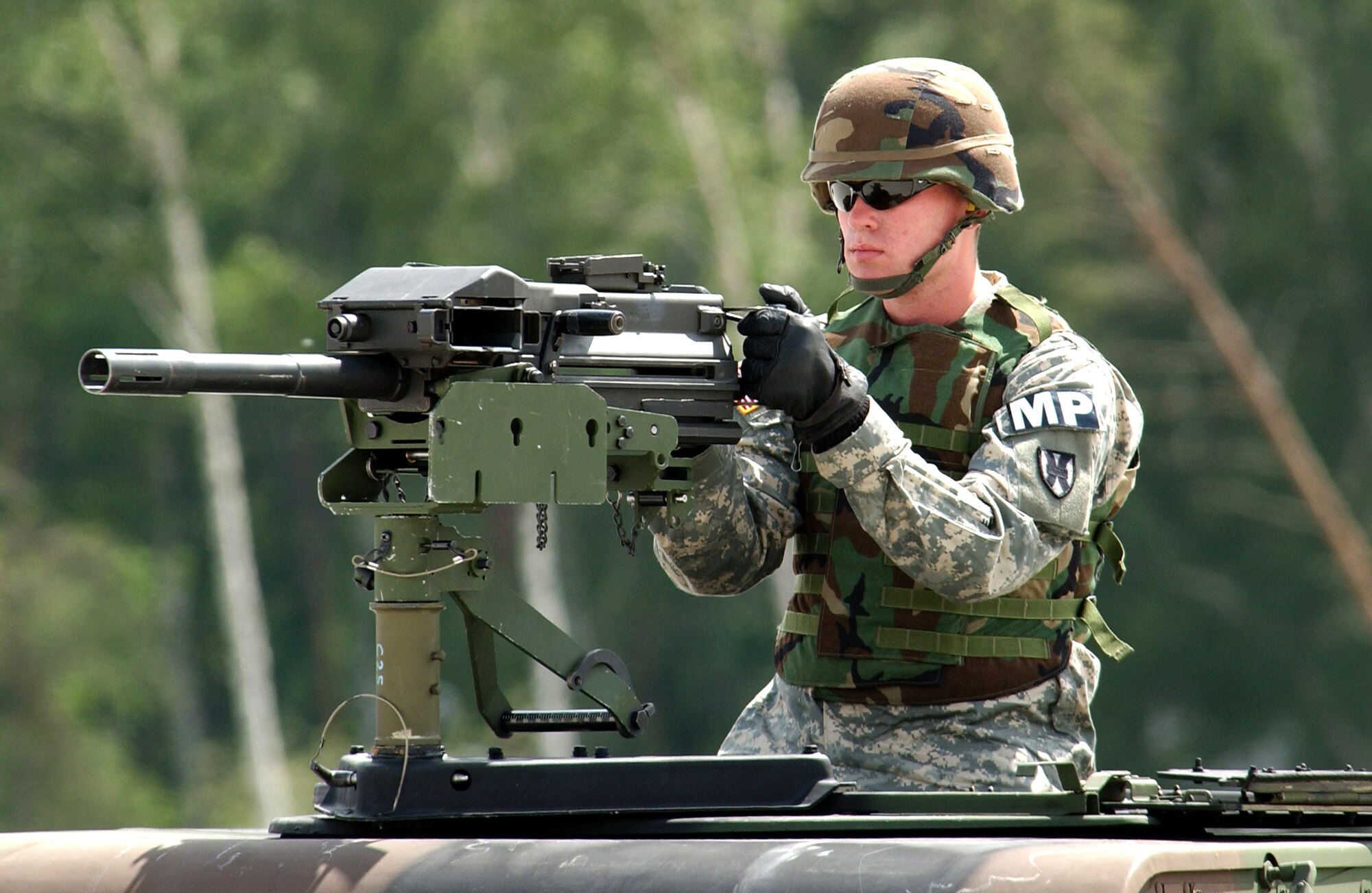 A Soldier from the 230th Military Police Company secures the area around a C-17 Globemaster III after a simulated assault landing during Operation Vigilant Star at Ramstein Air Base, Germany, on Wednesday, May 24, 2006. The purpose of this operation was to showcase the capabilities of the C-17 to NATO countries. (U.S. Air Force photo/Senior Airman Chris Willis)
