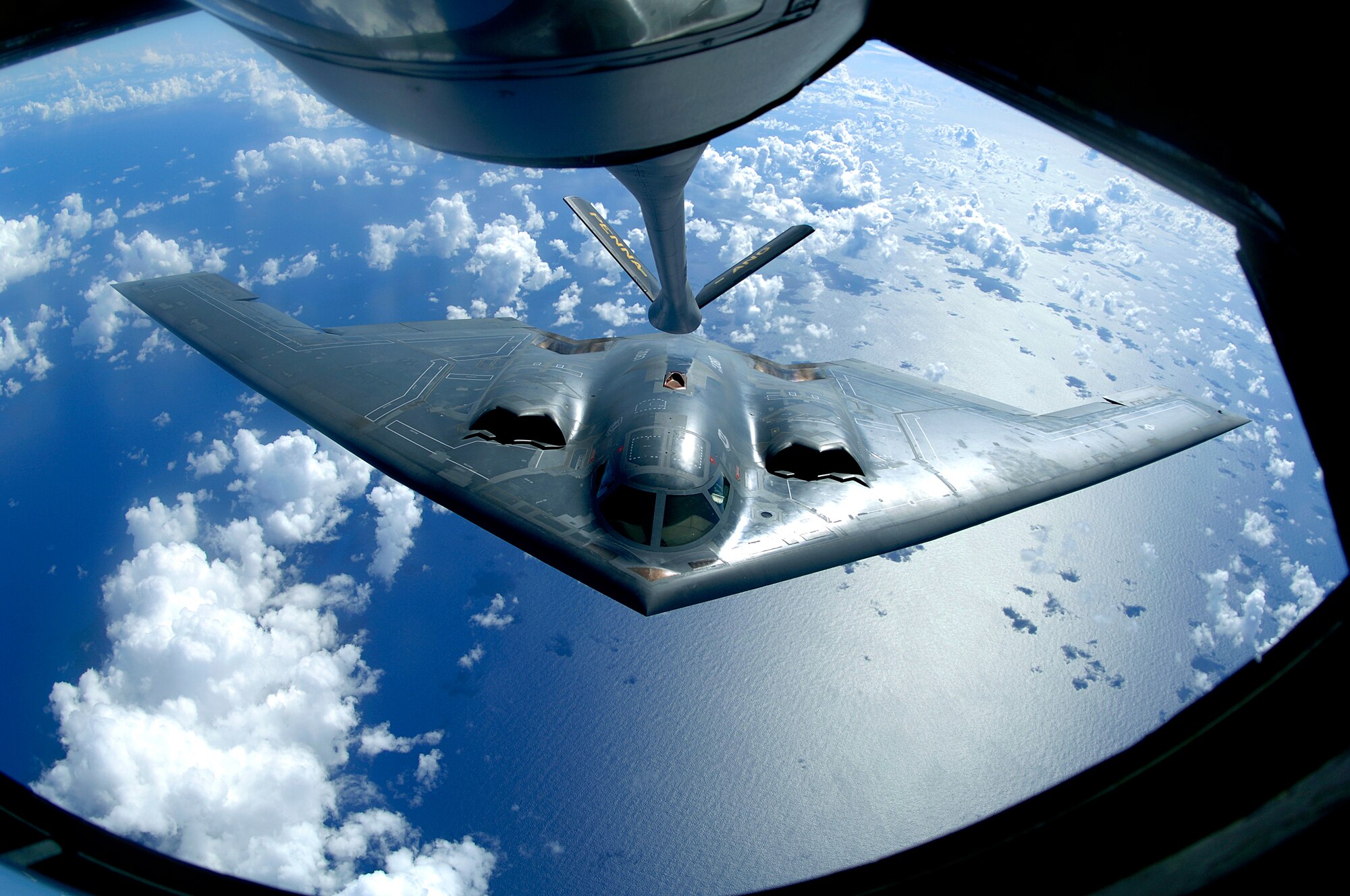 A B-2 Spirit moves into position for refueling from a KC-135 Stratotanker over the Pacific Ocean on Tuesday, May 30, 2006. The B-2 is from the 509th Bomb Wing at Whiteman Air Force Base, Mo., and the KC-135 is from the Pennsylvania Air National Guard's 171st Air Refueling Wing at the Pittsburgh International Airport. The bomber is part of Pacific Command's continuous bomber presence in the Asia-Pacific region. (U.S. Air Force photo/Staff Sgt. Bennie J. Davis III) 