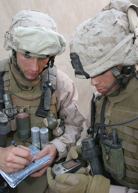 RAMADI, Iraq - U.S. Marine Corps Lance Cpl. Steven T. Gianetto and Cpl. Luis M. Perez receive their location coordinates via a Global Positioning System device recently. Lance Cpl. Gianetto and Cpl. Perez are attached to India Company, 3rd Battalion, 8th Marine Regiment. (U.S. Marine Corps photo by Lance Cpl. William L. Dubose III)