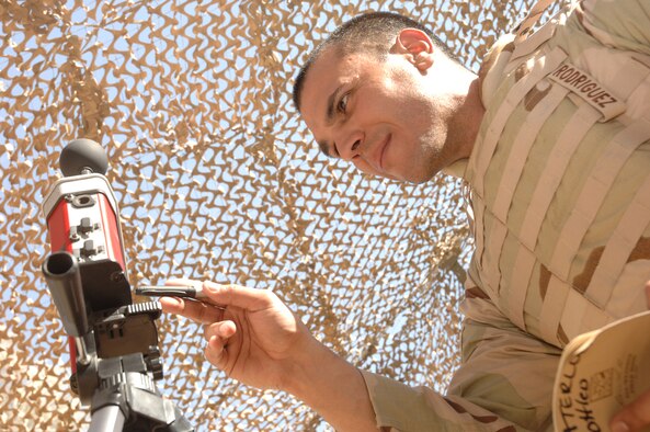 SATHER AIR BASE, Iraq -- Staff Sgt. Mark Rodriguez, a bioenvironmental technician deployed to the 447th Air Expeditionary Group, reads the wet bulb globe temperature at Sather Air Base in Baghdad May 25.  Temperatures are starting to creep above the century mark in Baghdad and will continue to climb as the summer wears on. Sergeant Rodriguez is deployed from the 21st Space Wing at Peterson Air Force Base, Colo.  (U.S. Air Force photo by Staff Sgt. Bryan Bouchard)