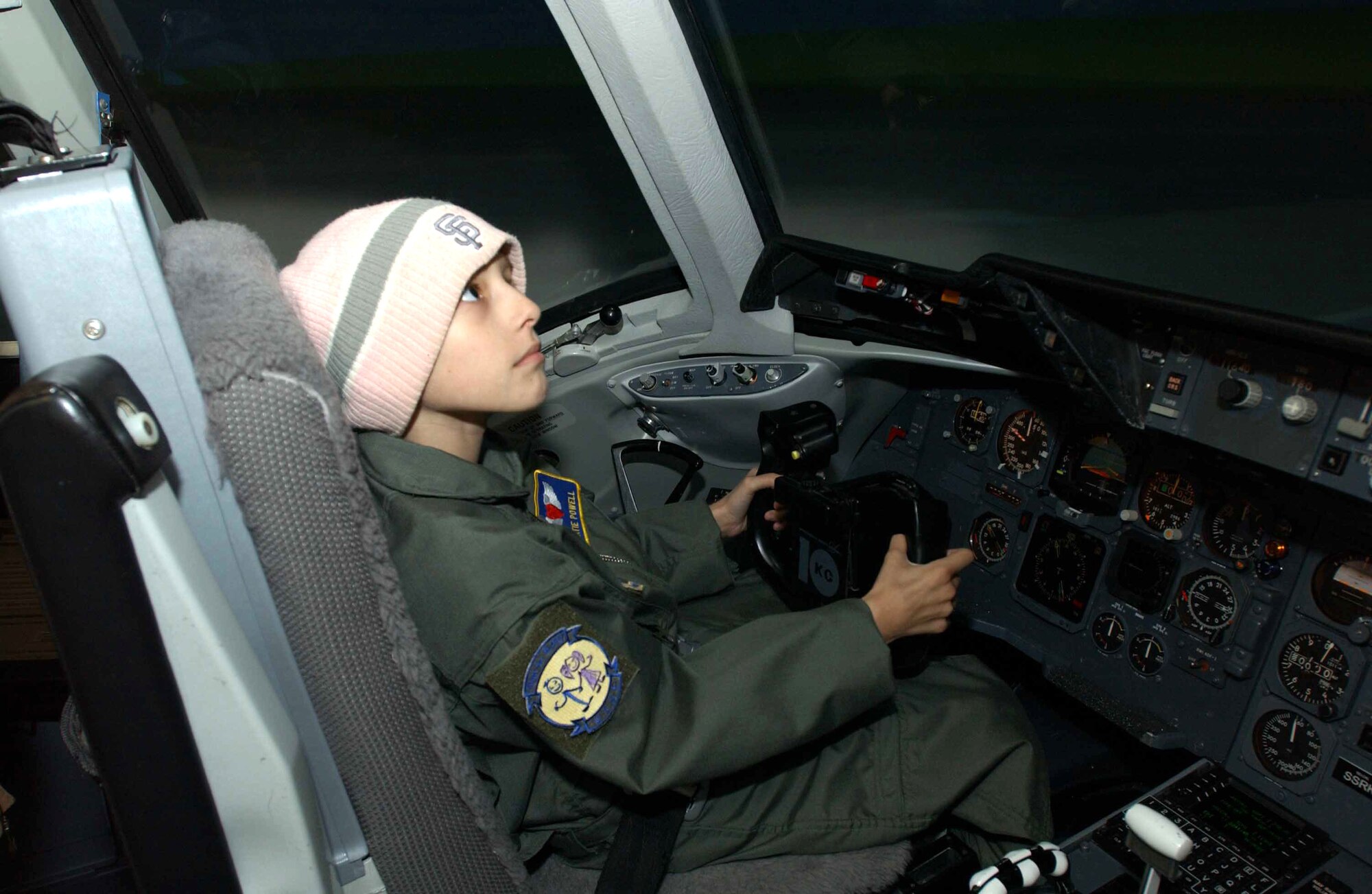 Ten-year-old Katie Powell flies a KC-10 Extender simulator at Travis Air Force Base, Calif., as part of the Pilot for a Day program on Friday, May 19, 2006. The program provides wish-fulfillment opportunities to local children with life-threatening diseases. Katie is fighting Ewing’s Sarcoma, a rare bone cancer. She is the daughter of Senior Master Sgt. Chris Powell, 60th Operations Group. (U.S. Air Force photo/Andre Mansour)
