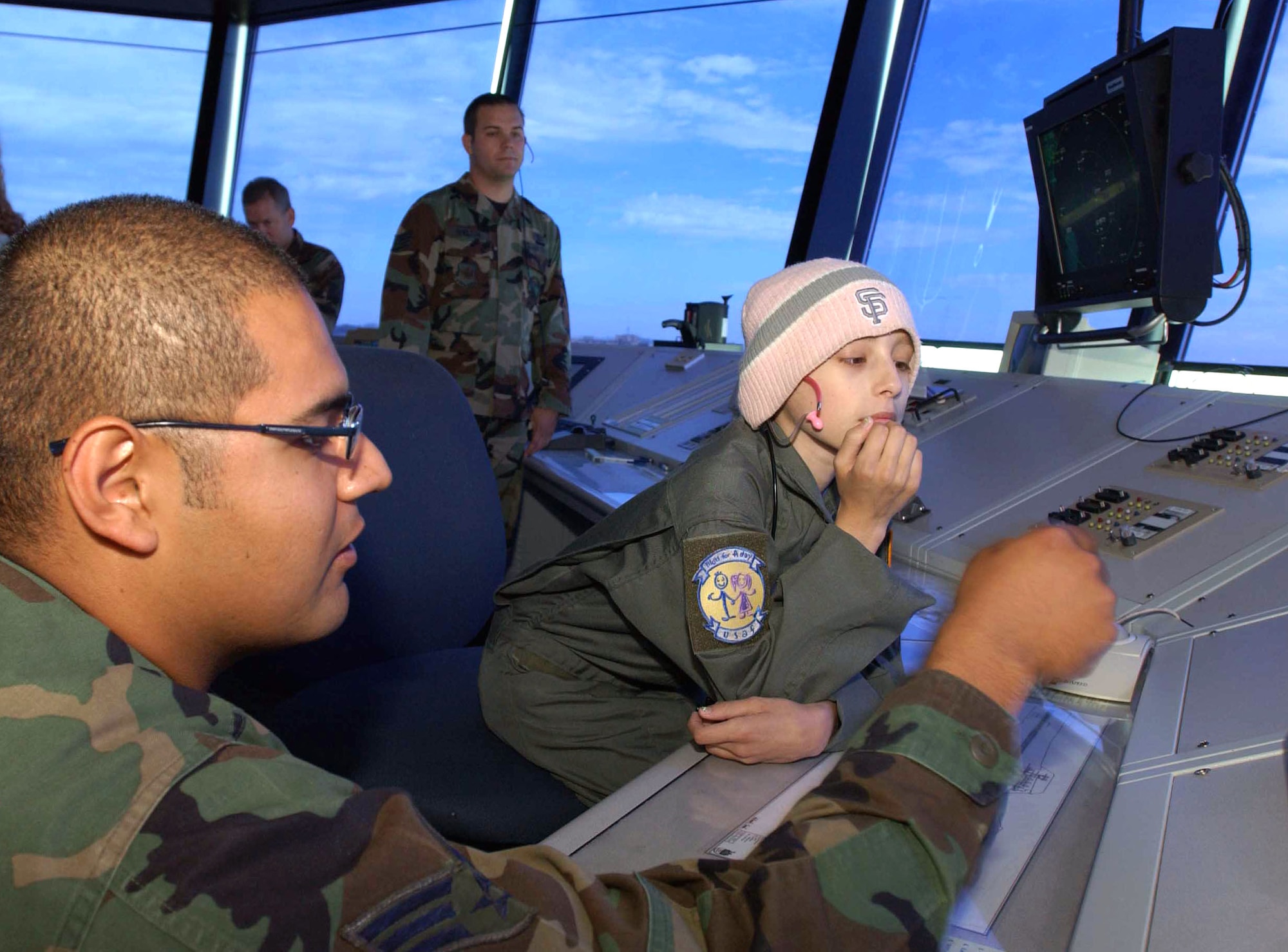 Ten-year-old Katie Powell visits the air traffic control tower at Travis Air Force Base, Calif., as part of the Pilot for a Day program on Friday, May 19, 2006. The program provides wish-fulfillment opportunities to local children with life-threatening diseases. Katie is fighting Ewing’s Sarcoma, a rare bone cancer. She is the daughter of Senior Master Sgt. Chris Powell, 60th Operations Group. (U.S. Air Force photo/Andre Mansour)
