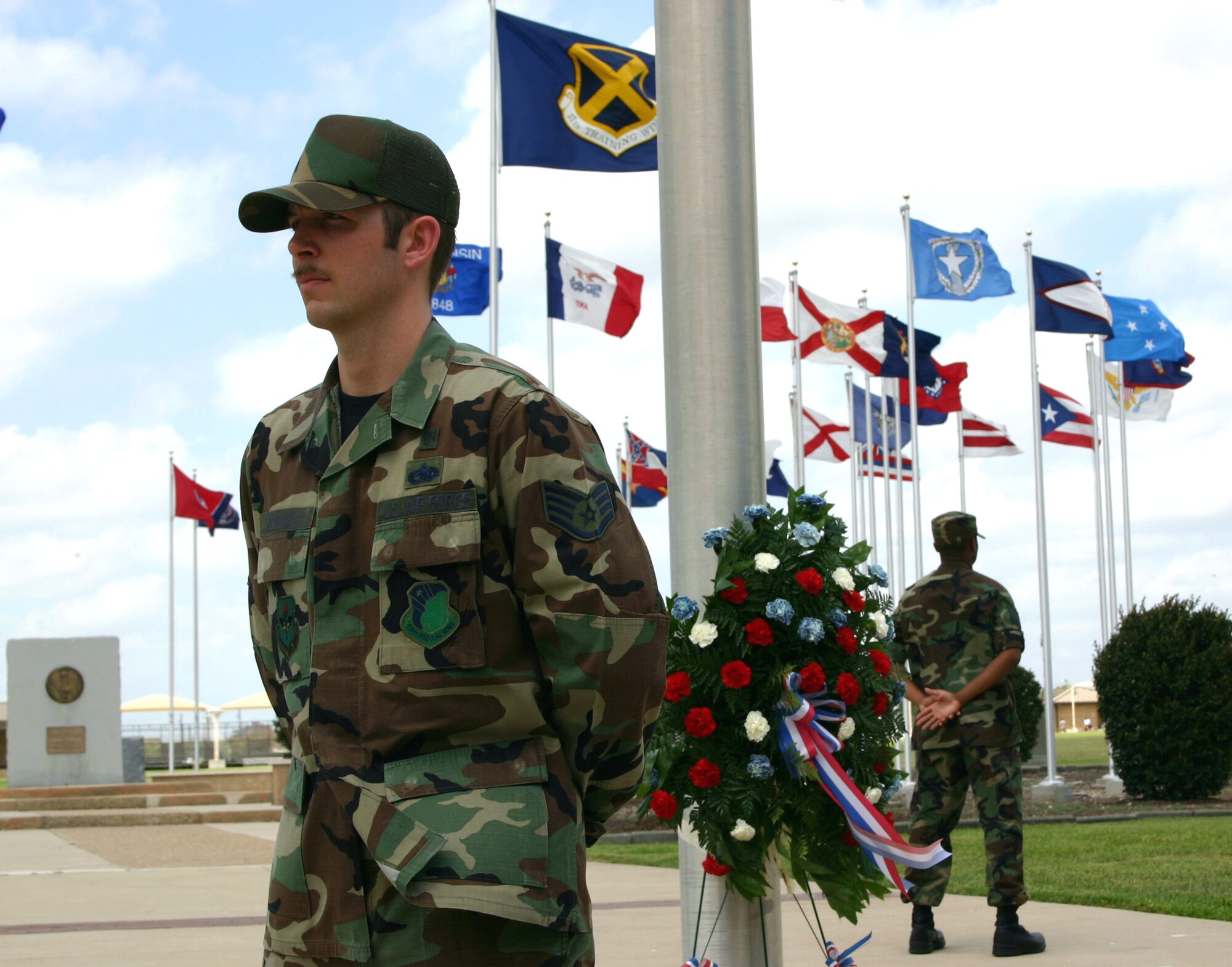 Staff Sgt. Aaron Bowman stands at parade rest in silent vigil along with other members of the 59th Medical Wing's physical medicine flight at Lackland Air Force Base, Texas, on Friday, May 26, 2006. The vigil, part of the base's Memorial Day observances, honored the contributions of servicemembers who are, or were, missing in action or prisoners of war. Each shift stood vigil for 10 minutes during the eight-and-a-half-hour observance. (U.S. Air Force photo/Master Sgt. Kimberly Spencer) 