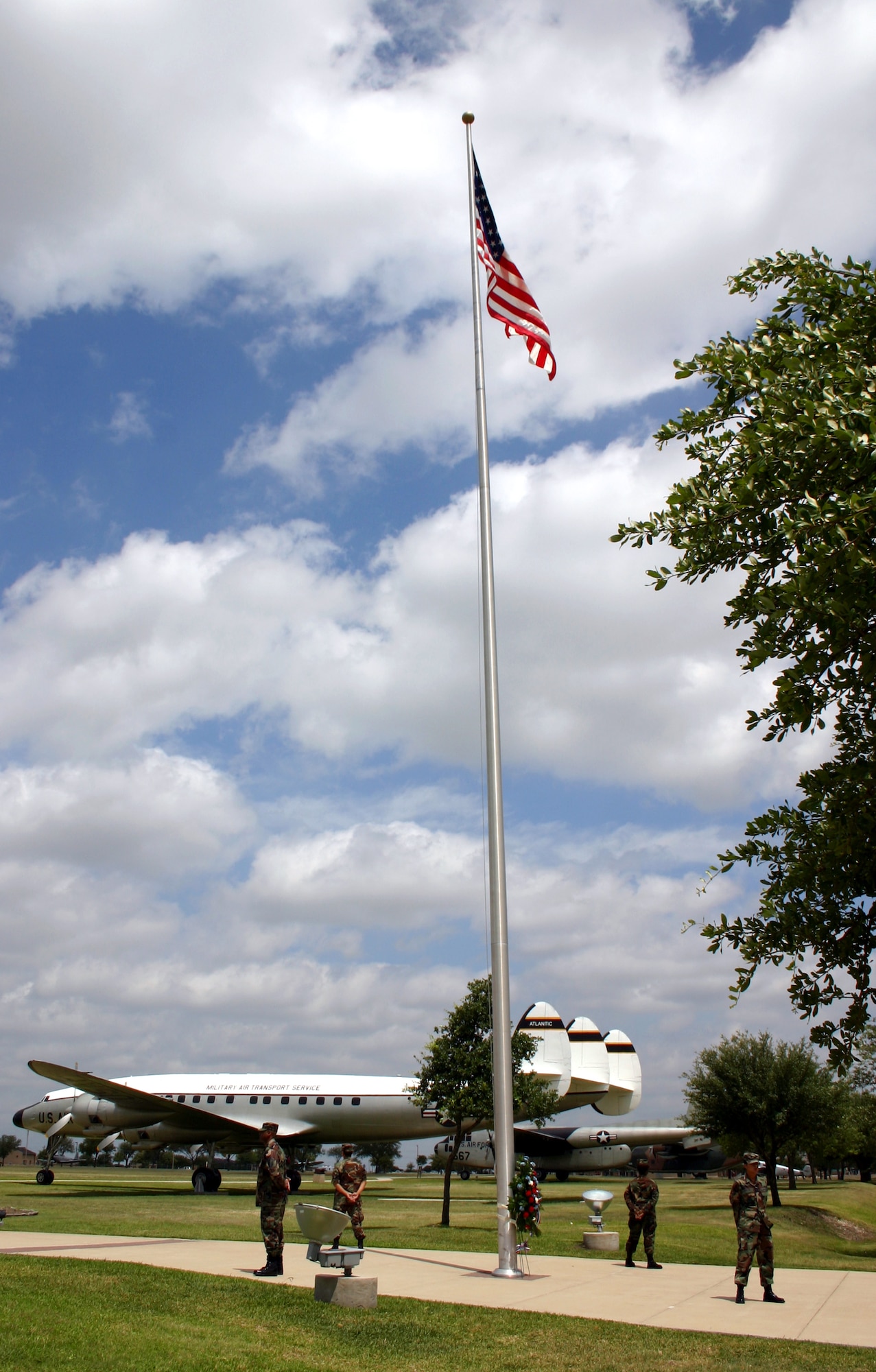 Four Airmen from the 59th Medical Wing's physical medicine flight stand in silent vigil at Lackland Air Force Base, Texas, on Friday, May 26, 2006. The vigil, part of the base's Memorial Day observances, honored the contributions of servicemembers who are, or were, missing in action or prisoners of war. Each shift stood vigil for 10 minutes during the eight-and-a-half-hour observance.  (U.S. Air Force photo/Master Sgt. Kimberly Spencer) 

