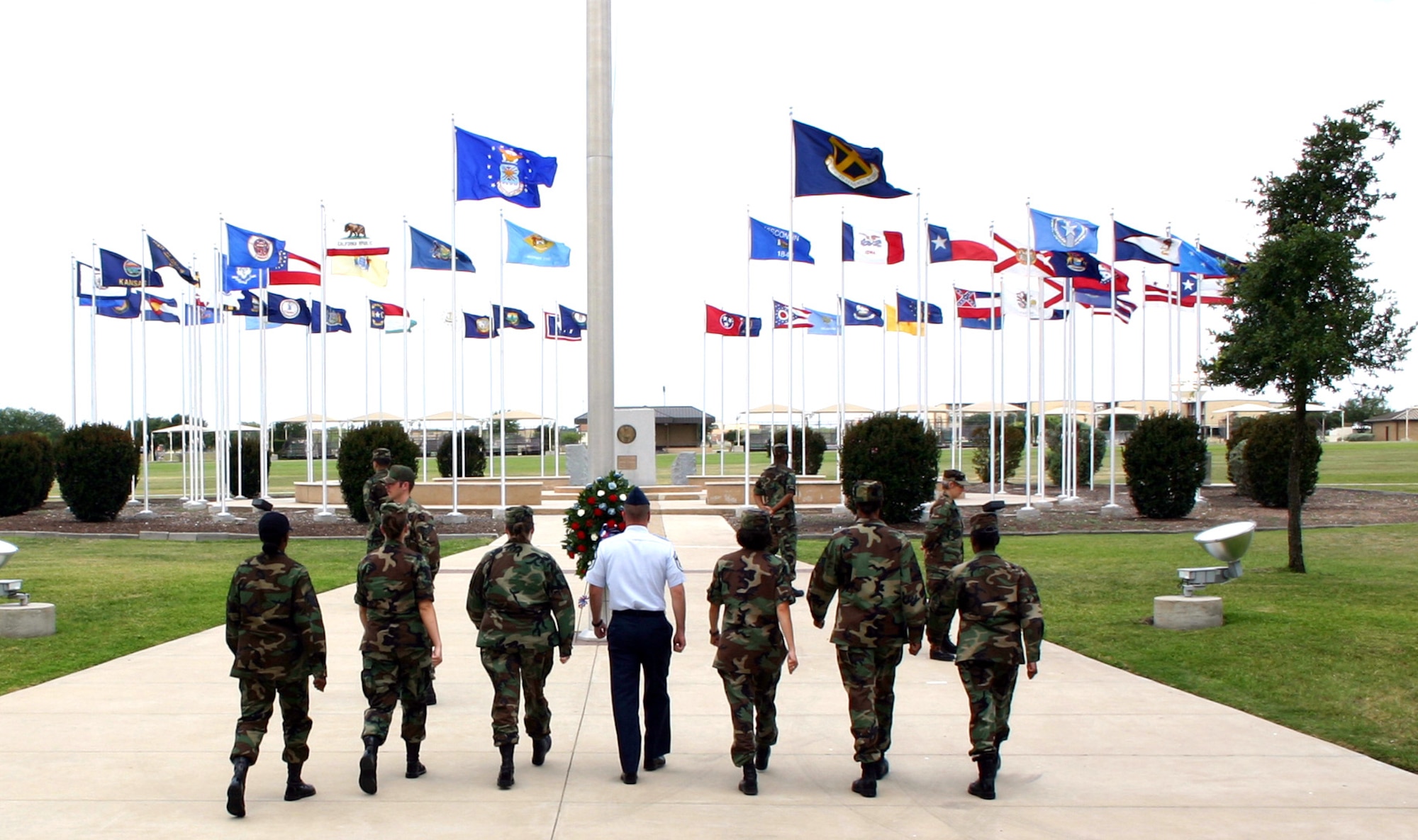 Airmen march forward to relieve others standing in a silent vigil at Lackland Air Force Base, Texas, on Friday, May 26, 2006. The vigil, part of the base's Memorial Day observances, honored the contributions of servicemembers who are, or were, missing in action or prisoners of war. Each shift stood vigil for 10 minutes during the eight-and-a-half-hour observance. (U.S. Air Force photo/Master Sgt. Kimberly Spencer)
