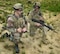 Army Spc. Chad Tobin (left) and Staff Sgt. Stephan Simmins participate in an On-The-Move training exercise in June at Fort Dix, N. J. The exercise featured Air Force technology applied to support the Army’s Future Force Warrior concept, including a goggle-mounted display, a hand-held mouse that activates push-to-talk personal computer voice command software, a backpack personal computer and power system, and rifle-mounted laser range finder. (Photo by David Darkow)