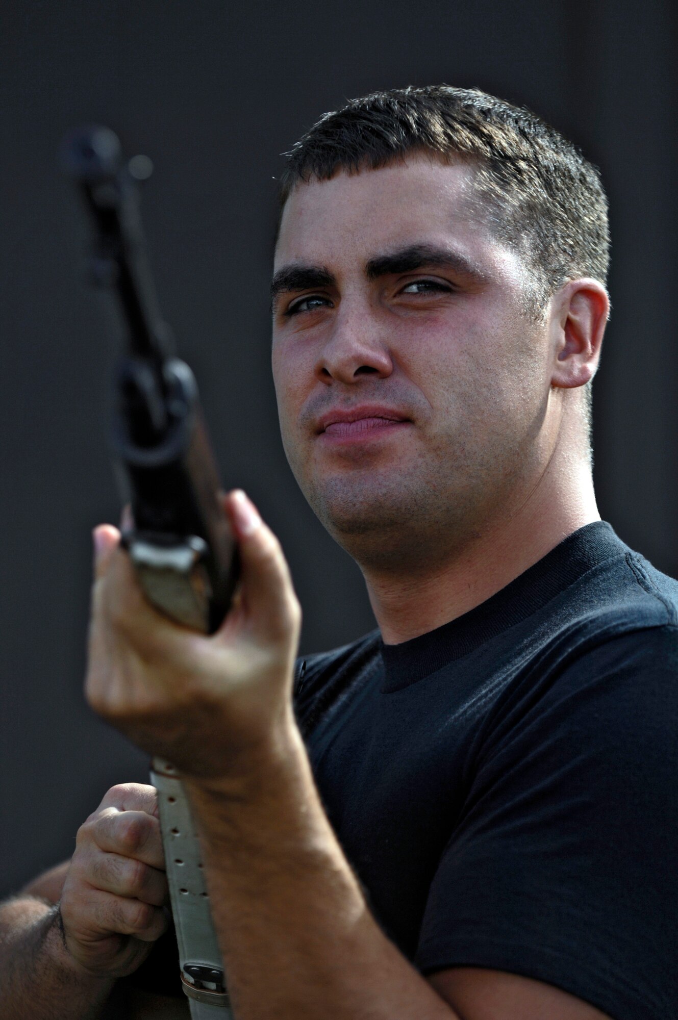 Senior Airman Adam Wade practices firing positions at Hickam Air Force Base, Hawaii Oct. 25. The 15th Airlift Wing Honor Guard emphasizes the importance of military customs and courtesies, dress and appearance, and drill and ceremony. (U.S. Air Force photo/Tech. Sgt. Shane A. Cuomo) 
