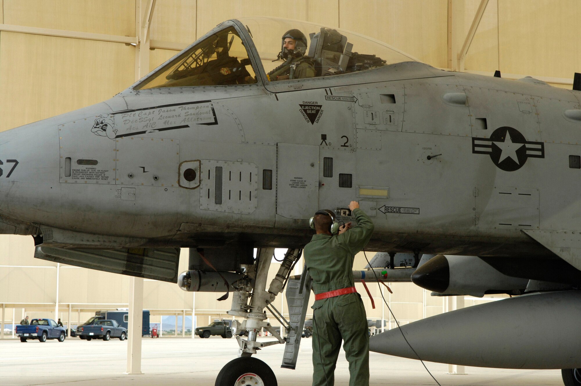 Tech. Sgt. Jerome Westbrook disconnects the direct communication cable as Capt. Andrew Tenenbaum prepares to taxi his A-10 Thunderbolt II Oct. 29.  Sergeant Westbrook is assigned to the 355th Aircraft Maintenance Squadron and Captain Tenenbaum is a pilot in the 354th Fighter Squadron at Davis-Monthan Air Force Base, Ariz.  (U.S. Air Force photo/Senior Airman Jesse Shipps)
