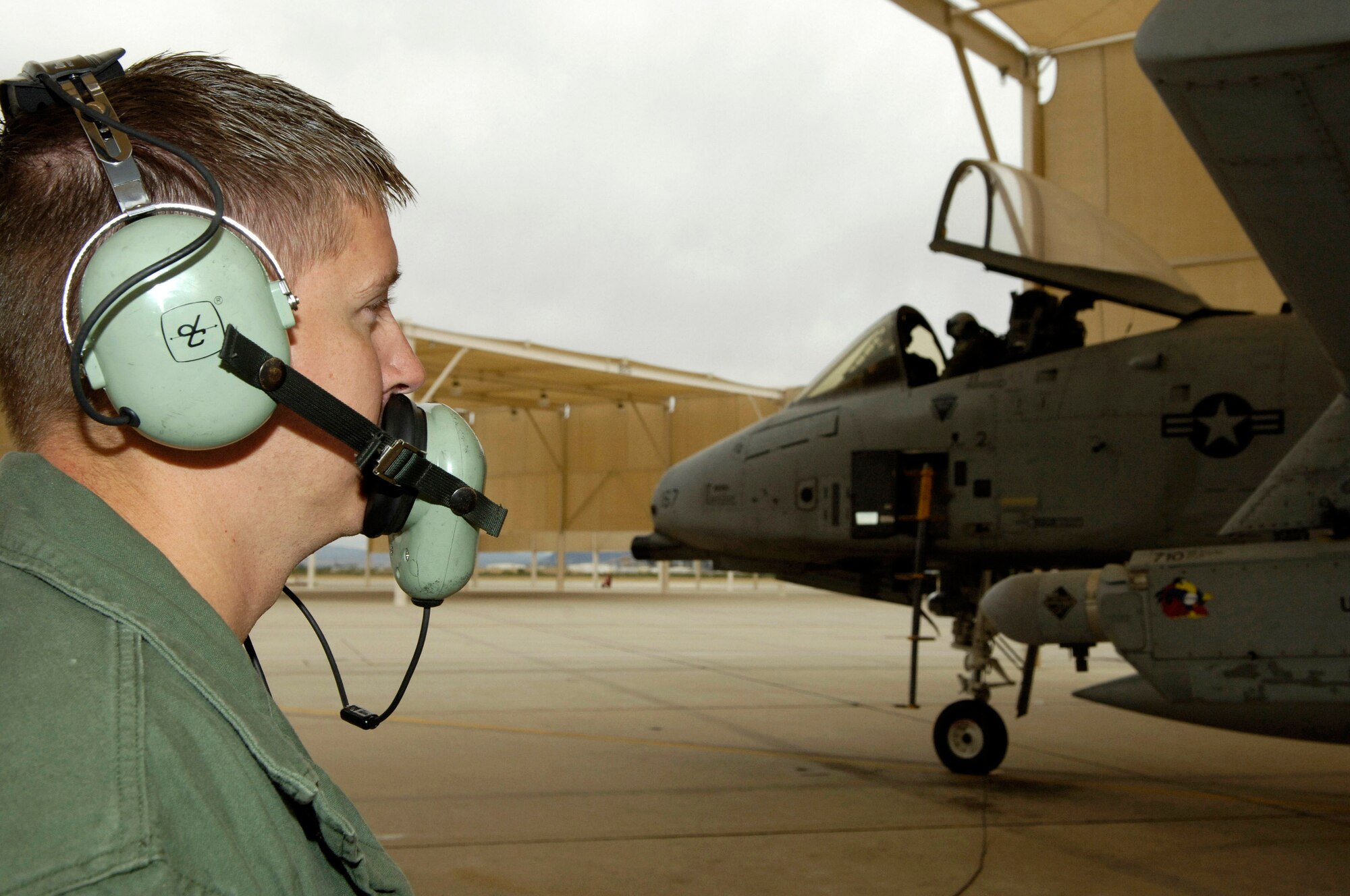 Tech. Sgt. Jerome Westbrook makes a communication check with Capt. Andrew Tenenbaum as the captain prepares to taxi his A-10 Thunderbolt II Oct. 29.  Sergeant Westbrook is assigned to the 355th Aircraft Maintenance Squadron and Captain Tenenbaum is a pilot in the 354th Fighter Squadron at Davis-Monthan Air Force Base, Ariz.  (U.S. Air Force photo/Senior Airman Jesse Shipps)
