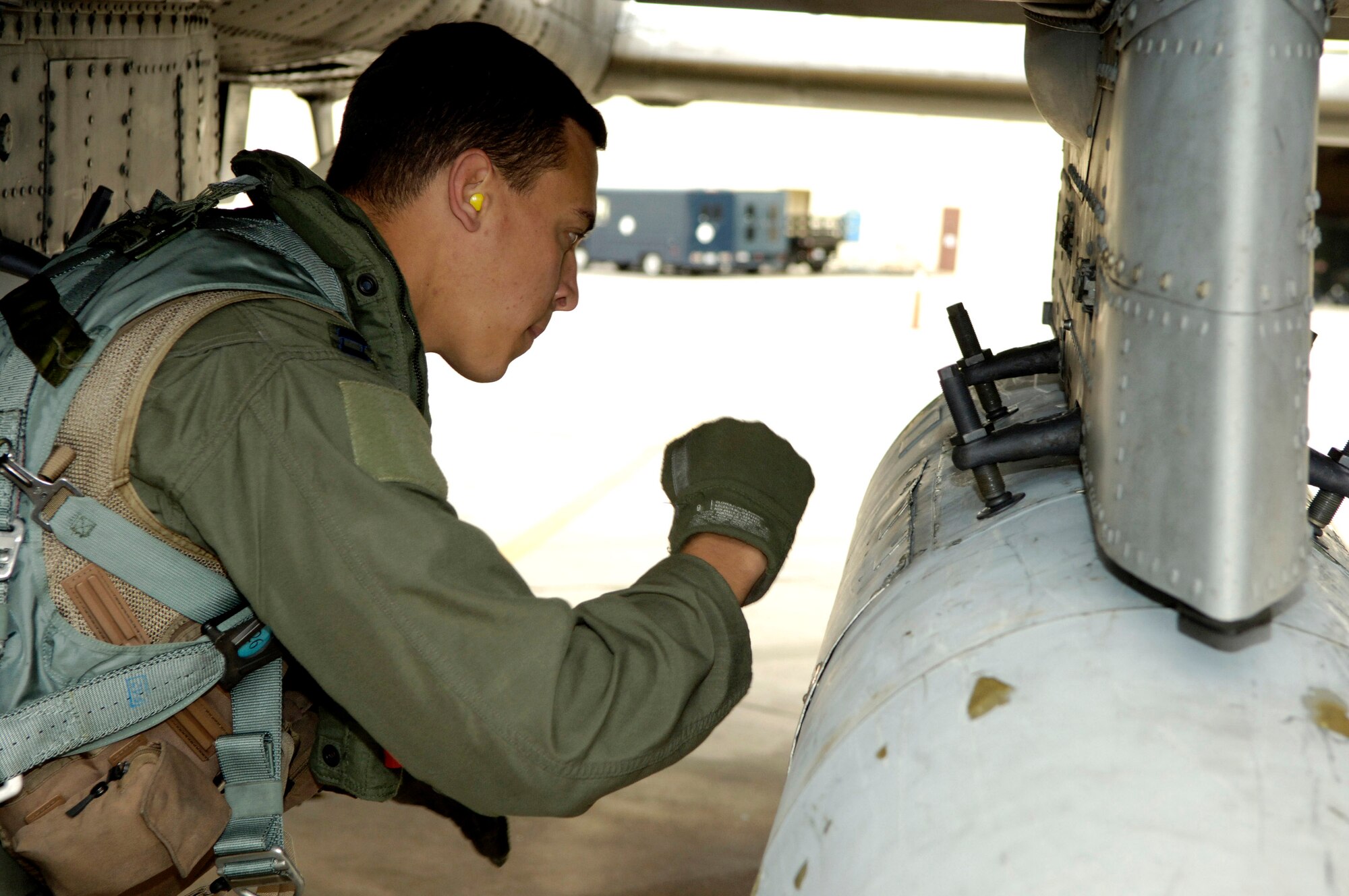 Capt. Andrew Tenenbaum performs a pre-flight inspection on his A-10 Thunderbolt II Oct. 29 prior to a mission.  Captain Tenenbaum is a pilot in the 354th Fighter Squadron at Davis-Monthan Air Force Base, Ariz.  (U.S. Air Force photo/Senior Airman Jesse Shipps)