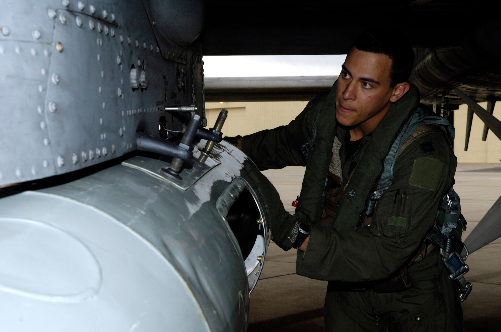 Capt. Andrew Tenenbaum performs a pre-flight inspection on his A-10 Thunderbolt II Oct. 29 prior to a mission.  Captain Tenenbaum is a pilot in the 354th Fighter Squadron at Davis-Monthan Air Force Base, Ariz.  (U.S. Air Force photo/Senior Airman Jesse Shipps)