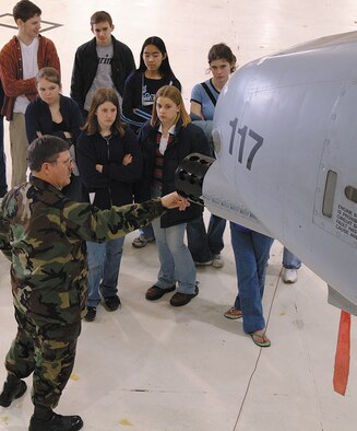 Col. Dewayne Burgess, now retired, gives Columbia, Mo., Wright-Flight studentws a tour of an A-10 Thunderbolt II from the 442nd Fighter Wing at Whiteman Air Force Base, Mo., last year.  Colonel Burgess was a prime mover in developing the Wright Flight program within the 442nd.  (U.S. Air Force photo/Staff Sgt. Angela Blazier) 