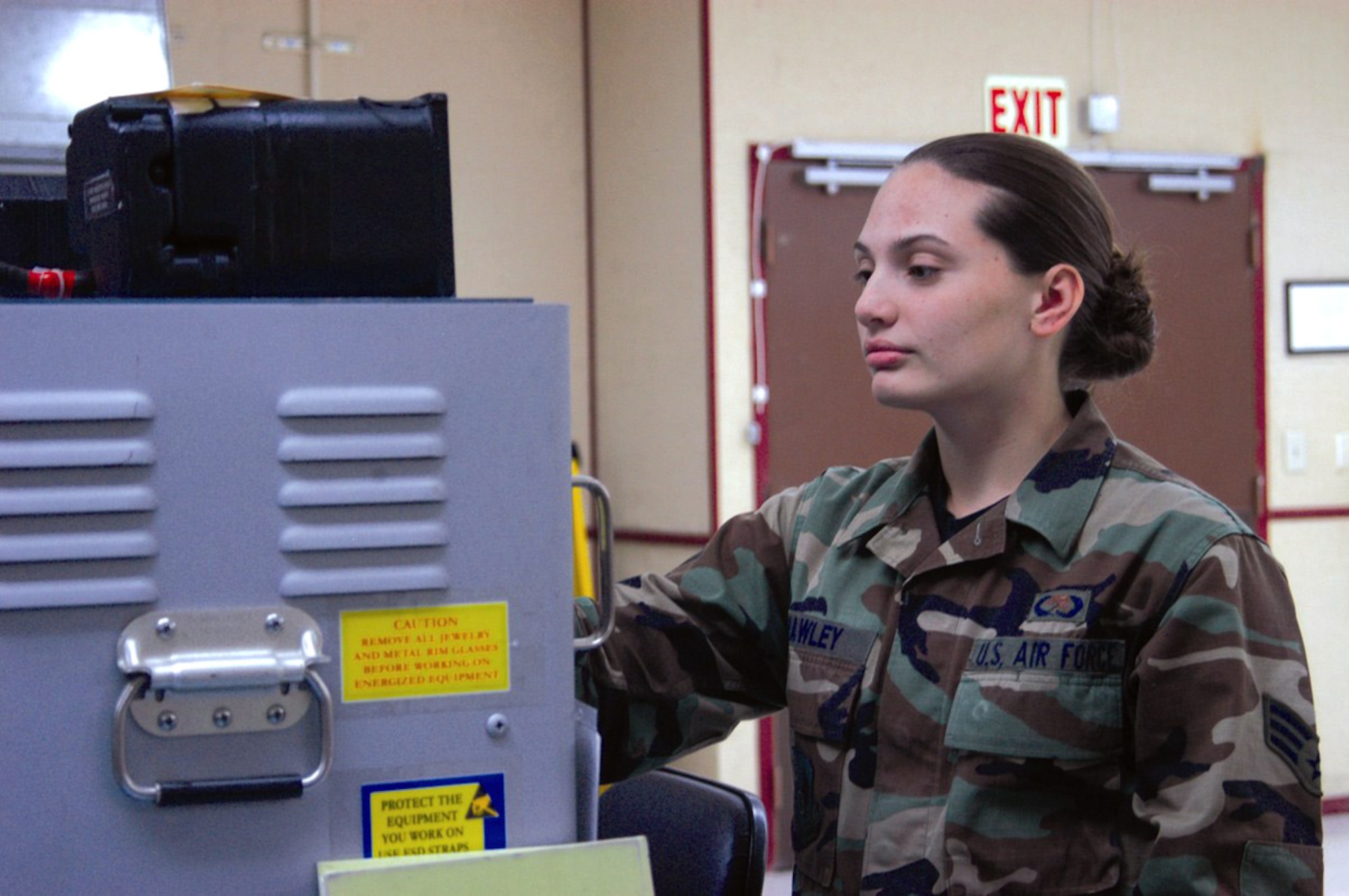 Senior Airman Sharon Howley, an integrated avionics mechanic, works with the T-38 flight director system test set. At age 19, Airman Howley is the youngest of more than 9,100 graduates earning their degrees in the October class of the Community College of the Air Force. She is also one of the youngest Airmen to earn a degree in the CCAF's 32-year history. Airman Howley is assigned to the 412th Maintenance Squadron at Edwards Air Force Base, Calif. (U.S. Air Force photo/Airman Stacy Garcia)
