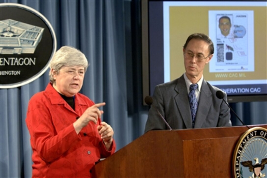 Director of the Defense Manpower Data Center Mary Dixon explains an aspect of the next generation of Common Access Card to reporters during a Pentagon press briefing with Under Secretary of Defense for Personnel and Readiness David S. Chu on Nov. 1, 2006.  The next generation card meets the common identification standard for all Federal departments and agencies.  
