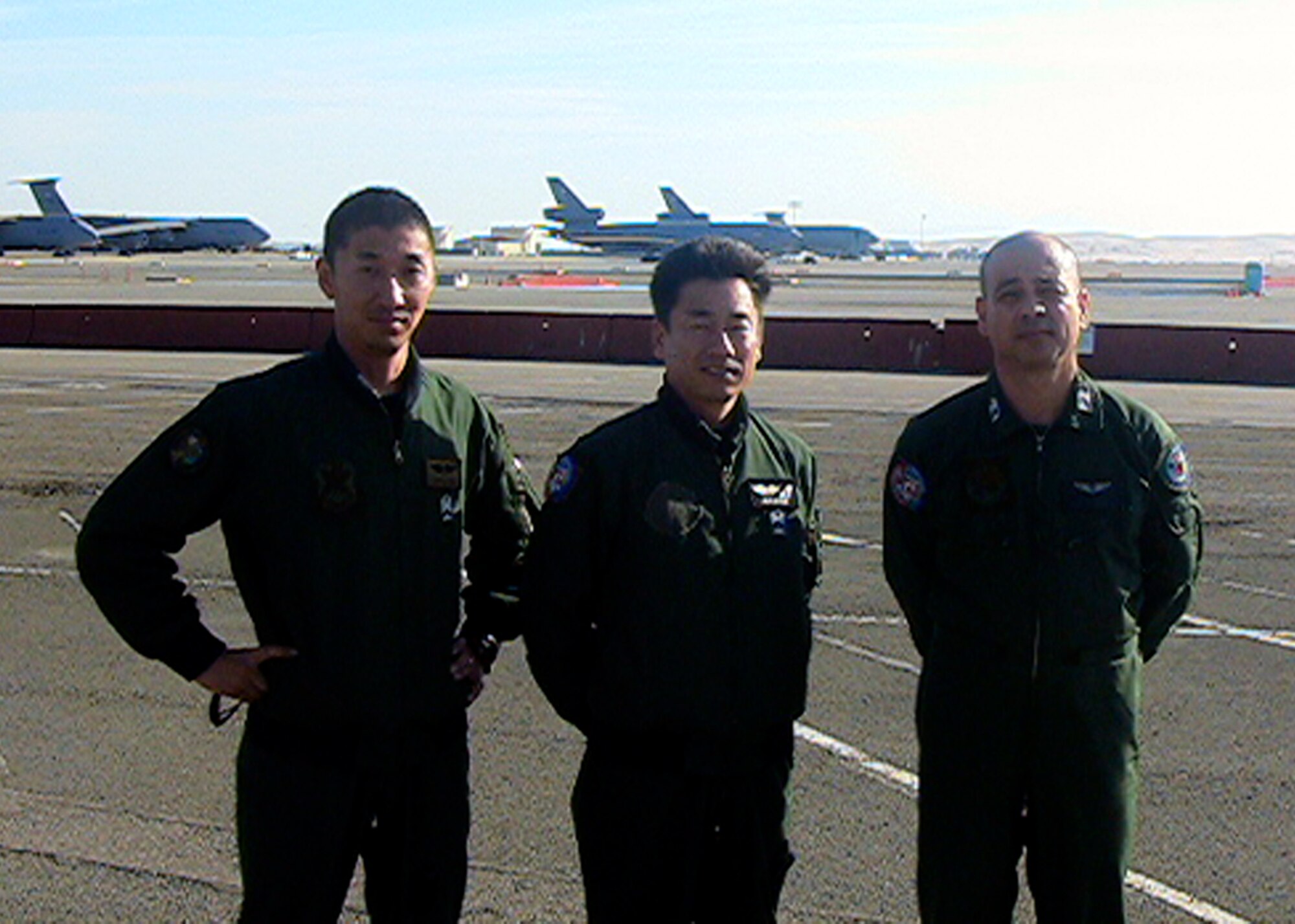 From left to right: Tech. Sgt. Masaaki Takahashi, Master Sgt. Etsuro Mizokami and Master Sgt. Randy Kawasaki, Japan Air Self Defense Force, were selected to be their country's first boom operators. (U.S. Air Force photo)
