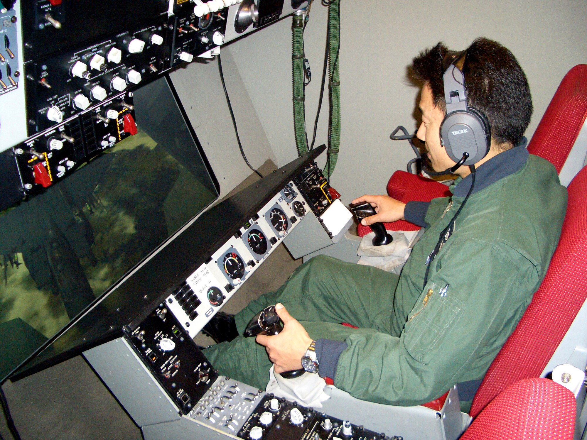 Master Sgt. Etsuro Mizokami, Japan Air Self Defense Force, simulates refueling an aircraft. He is one of three first boom operators ever for Japan’s JASDF taught at Travis. (Courtesy photo)