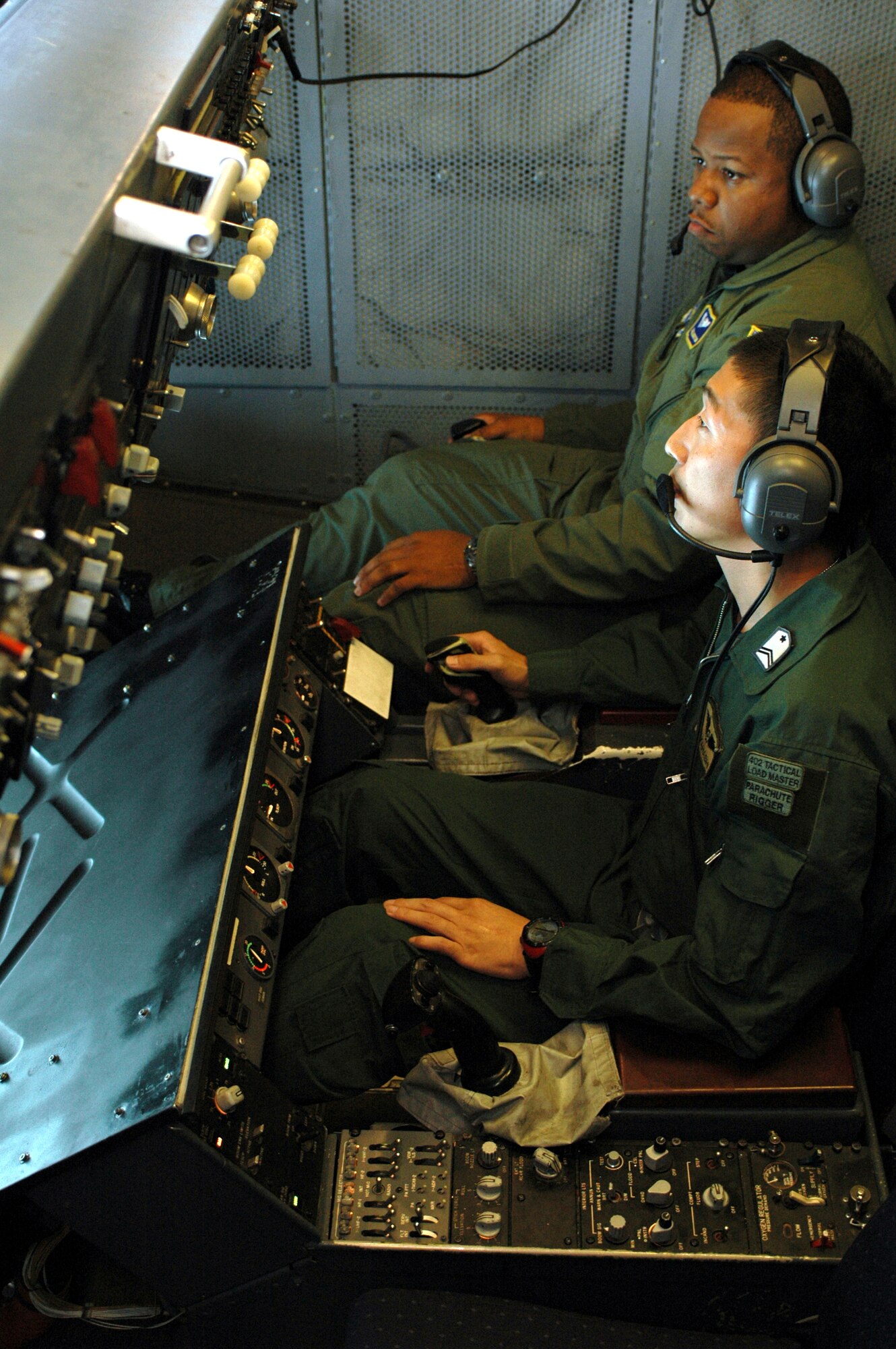 Staff Sgt. Dex Morton, 60th Operation Support Squadron, trains Tech. Sgt. Masaaki Takahashi, Japan Air Self Defense Force, on boom operation. Three members of the Japan Air Self Defense Force completed a four-month training program here, making them the first boom operators in the history of their military. (Photo by Staff Sgt. Matthew McGovern/ 60th AMW Public Affairs)