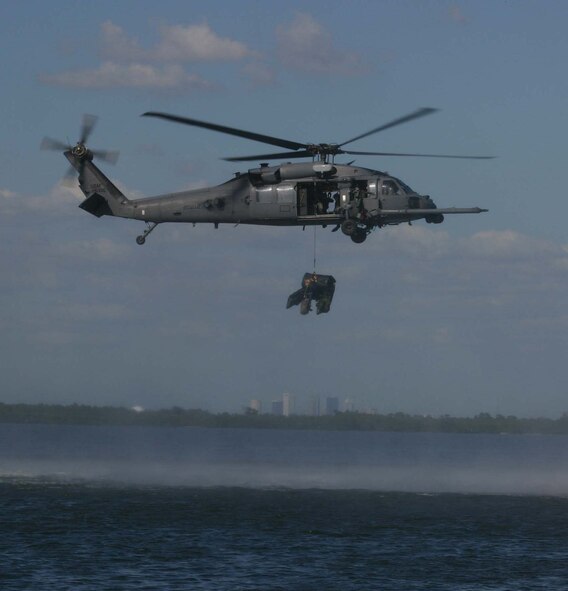 MACDILL AIR FORCE BASE, Fla. -- Pararescuemen deploy a A T-duck from an HH-60 Pave Hawk in preparation to extract a “downed pilot” during Exercise Atlantic Rescue ’07 at MacDill Air Force Base, Fla., Oct. 31.  More than 300 23rd Wing Airmen from Moody AFB, Ga., are testing their combat search and rescue skills during the exercise, which is dedicated to providing CSAR-focused training while integrating airborne command and control with various assets throughout the wing. (USAF Photo by Tony Banks)