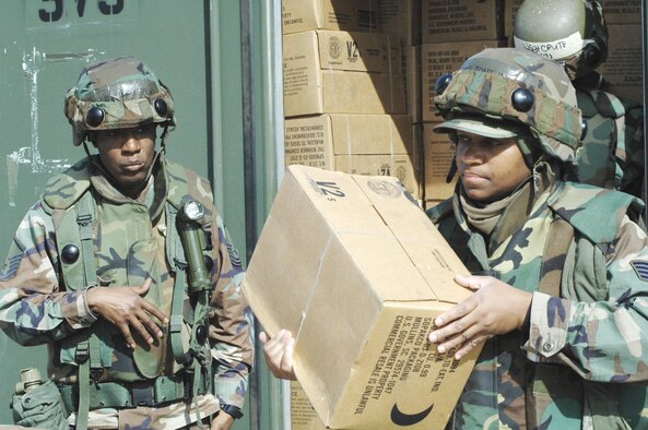Master Sgt. LaShell McClellan and Staff Sgt. Toni Beaty, 20th Services Squadron, unload Meals Ready to Eat at Eagle Flag. (U.S. Air Force photo/1st Lt. Allyson Strickland)