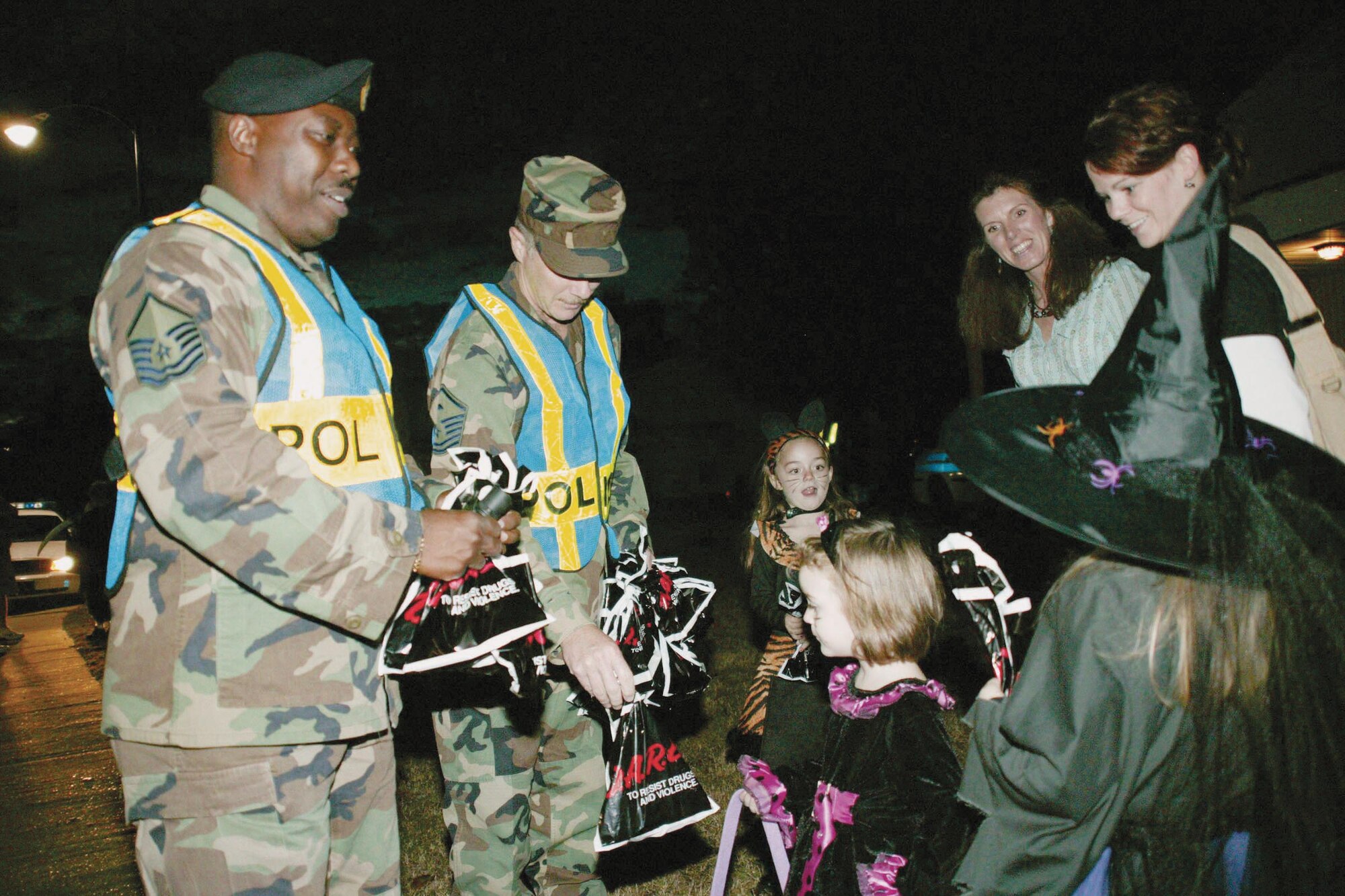 Following the re-opening of the 20th Security Forces Squadron substation, security forces "Pumpkin Patrol" members patrol housing to pass out candy and ensure safety. (U.S. Air Force photo/Tarsha Storey)