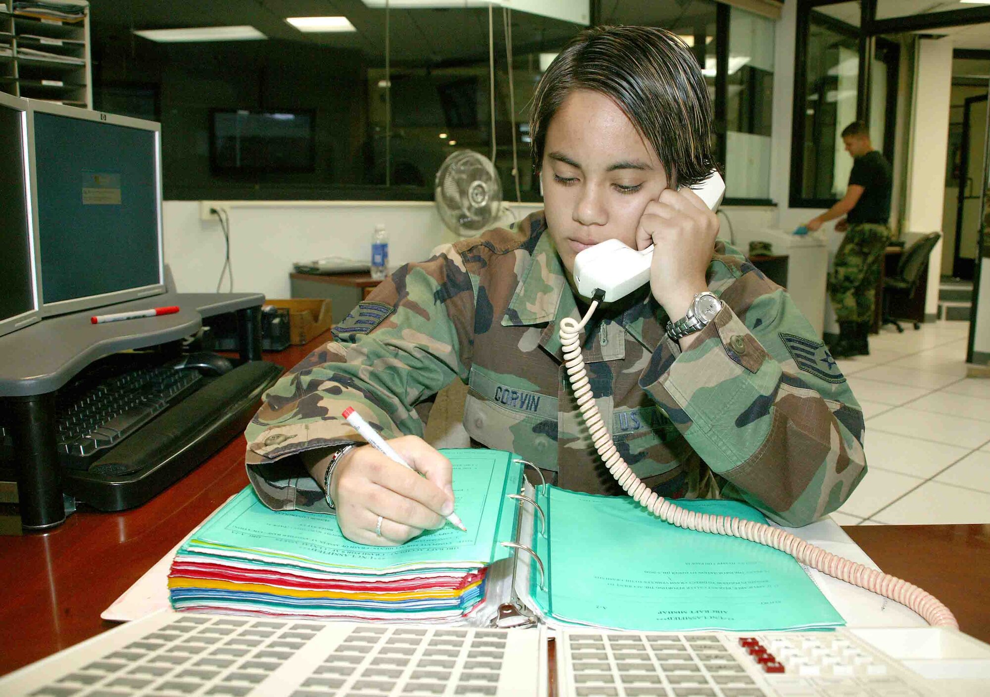 Staff Sgt. Christina Corvin, 20th Fighter Wing Command Post training manager, makes a few corrections to an emergency checklist Nov.1. (U.S. Air Force photo/Senior Airman John Gordinier)