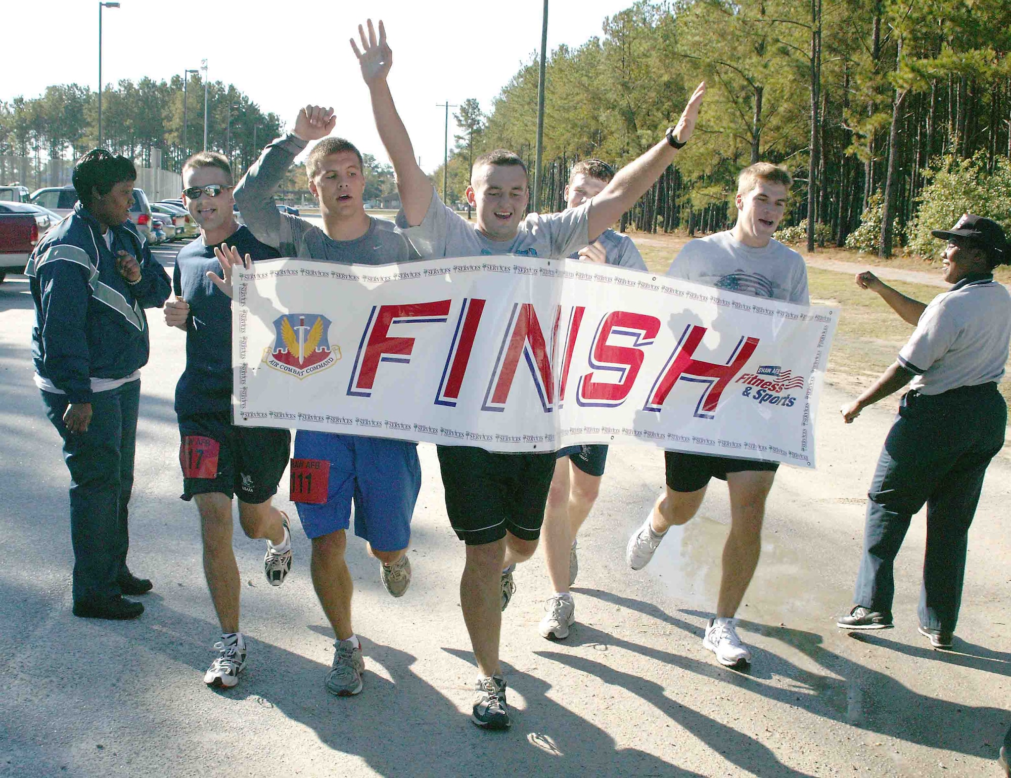 Second Lts. John Campion, 77th Fighter Squadron; Beau Tresemer, 20th Operations Support Squadron; Christopher Franks, 20th OSS, Zane Hershey; 20th OSS, and Rob Hutsell, 79th FS, cross the finish line Oct. 28 with a time of 1:50.19 during the half marathon. (U.S. Air Force photo/Senior Airman John Gordinier)